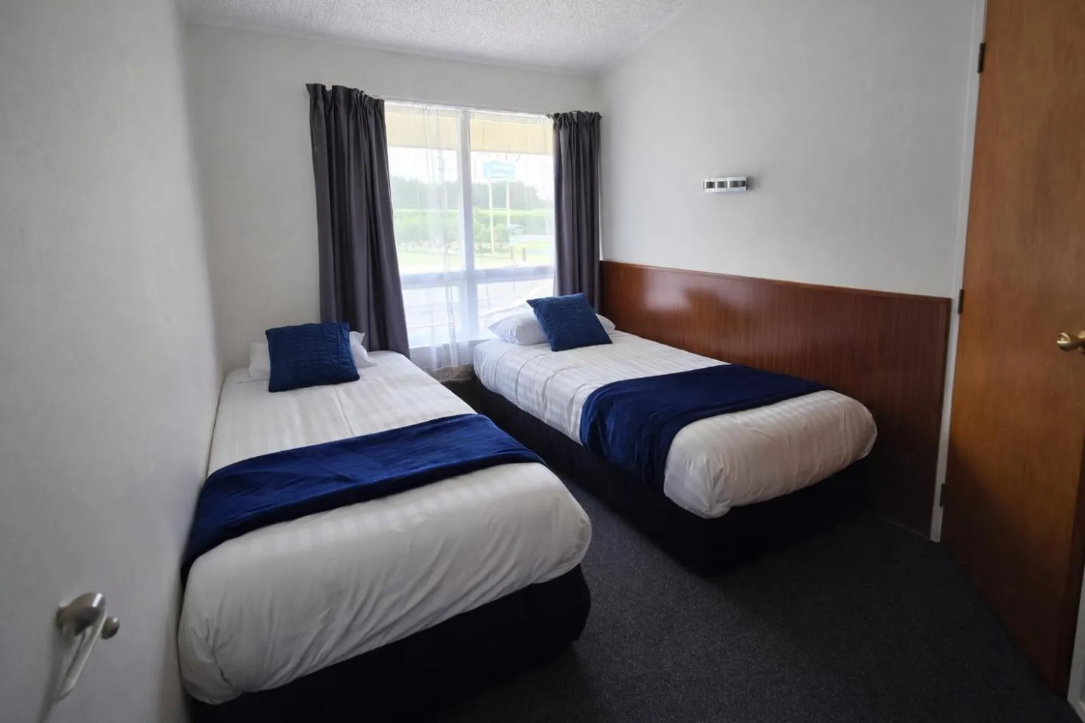 Bed in Tower Road Motel