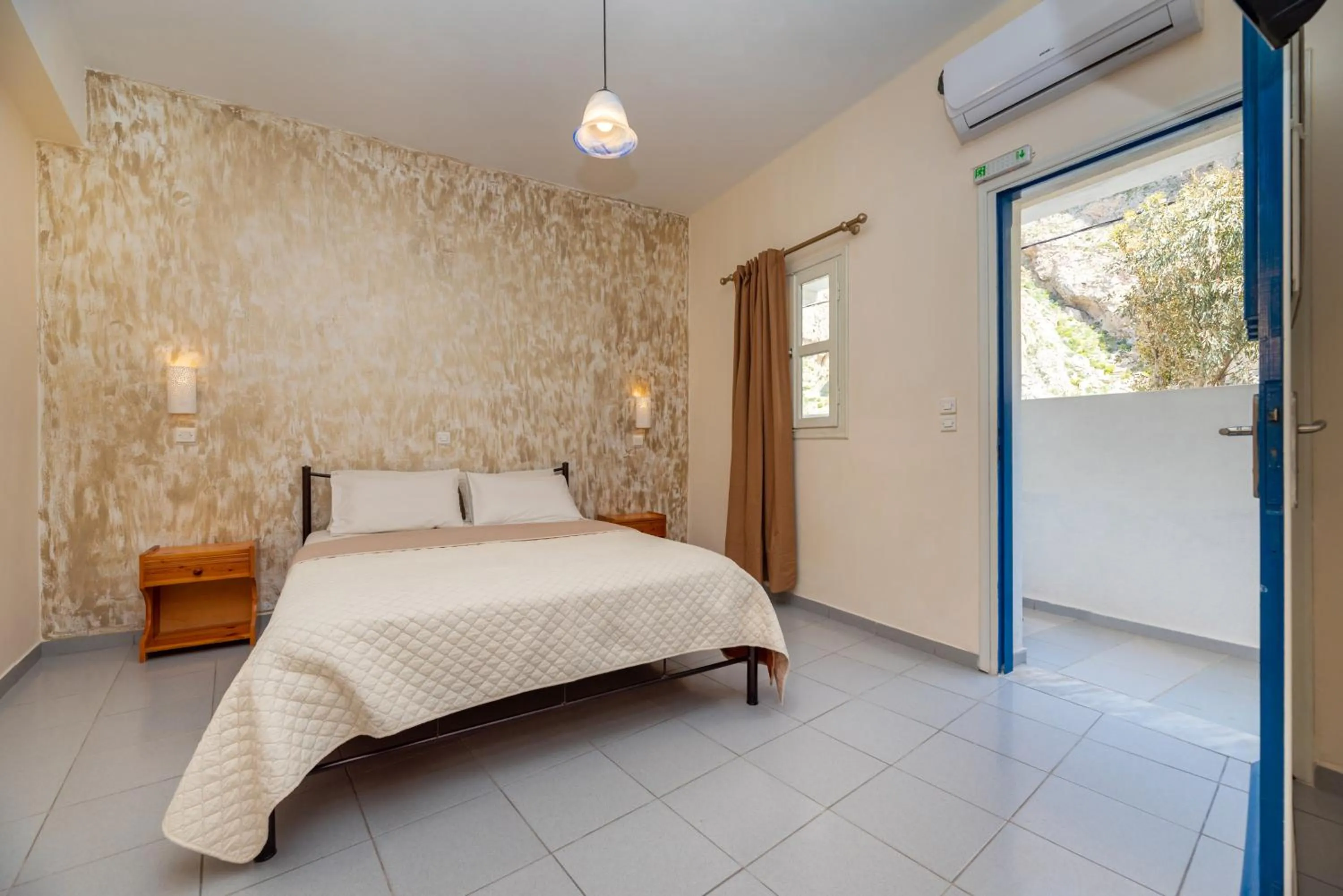 Bed in Onar Rooms & Studios