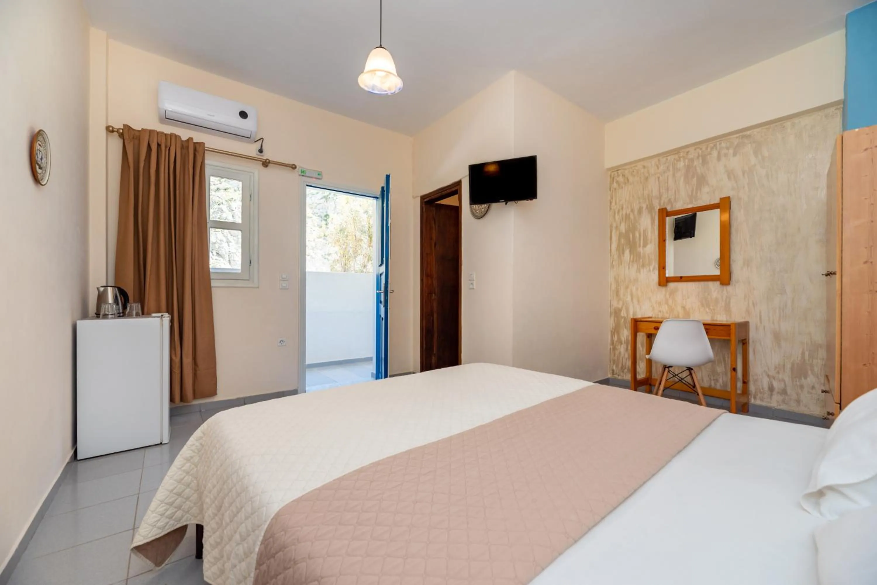 Bed in Onar Rooms & Studios