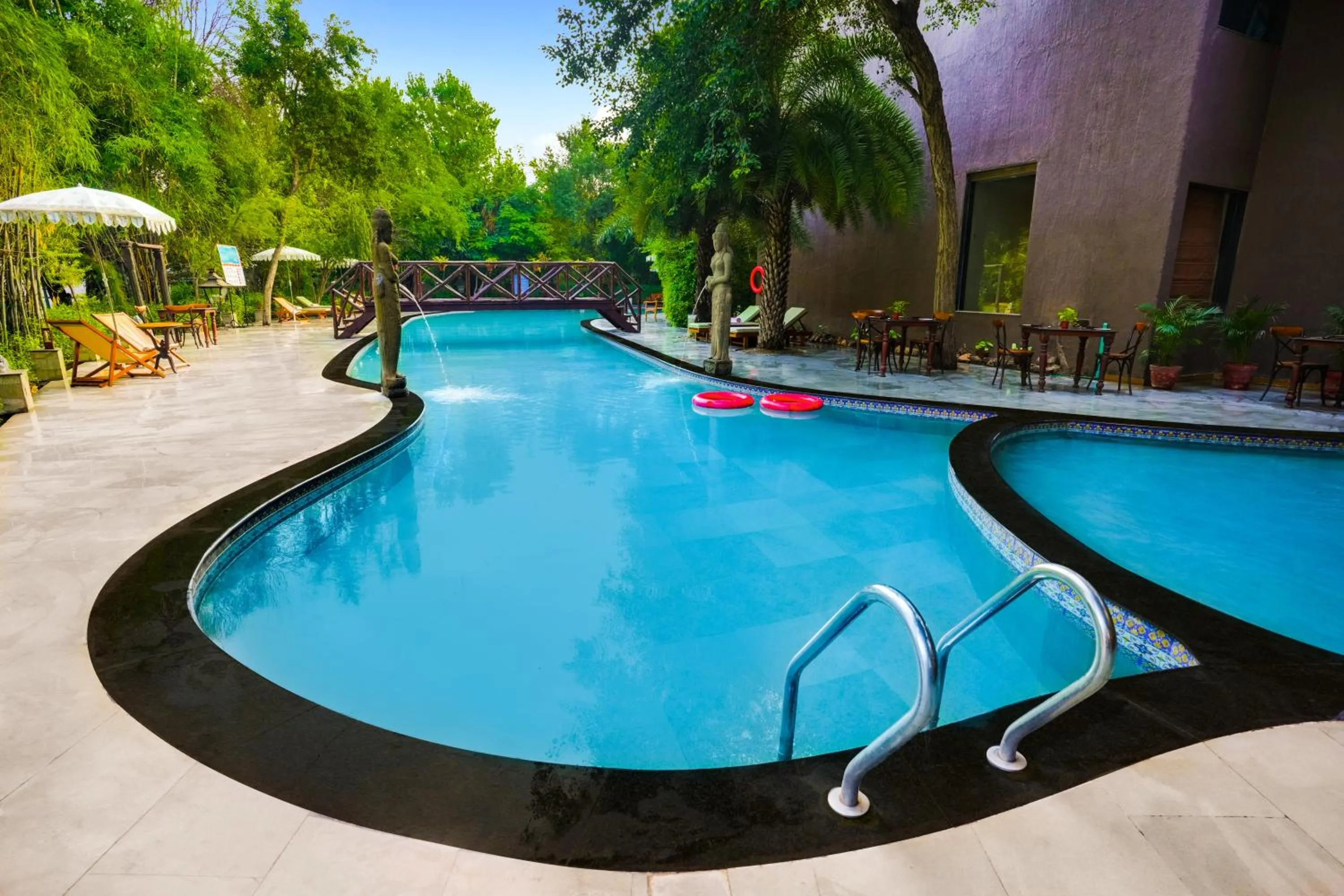 Swimming pool in The Tree House Resort, A Club Mahindra Associate