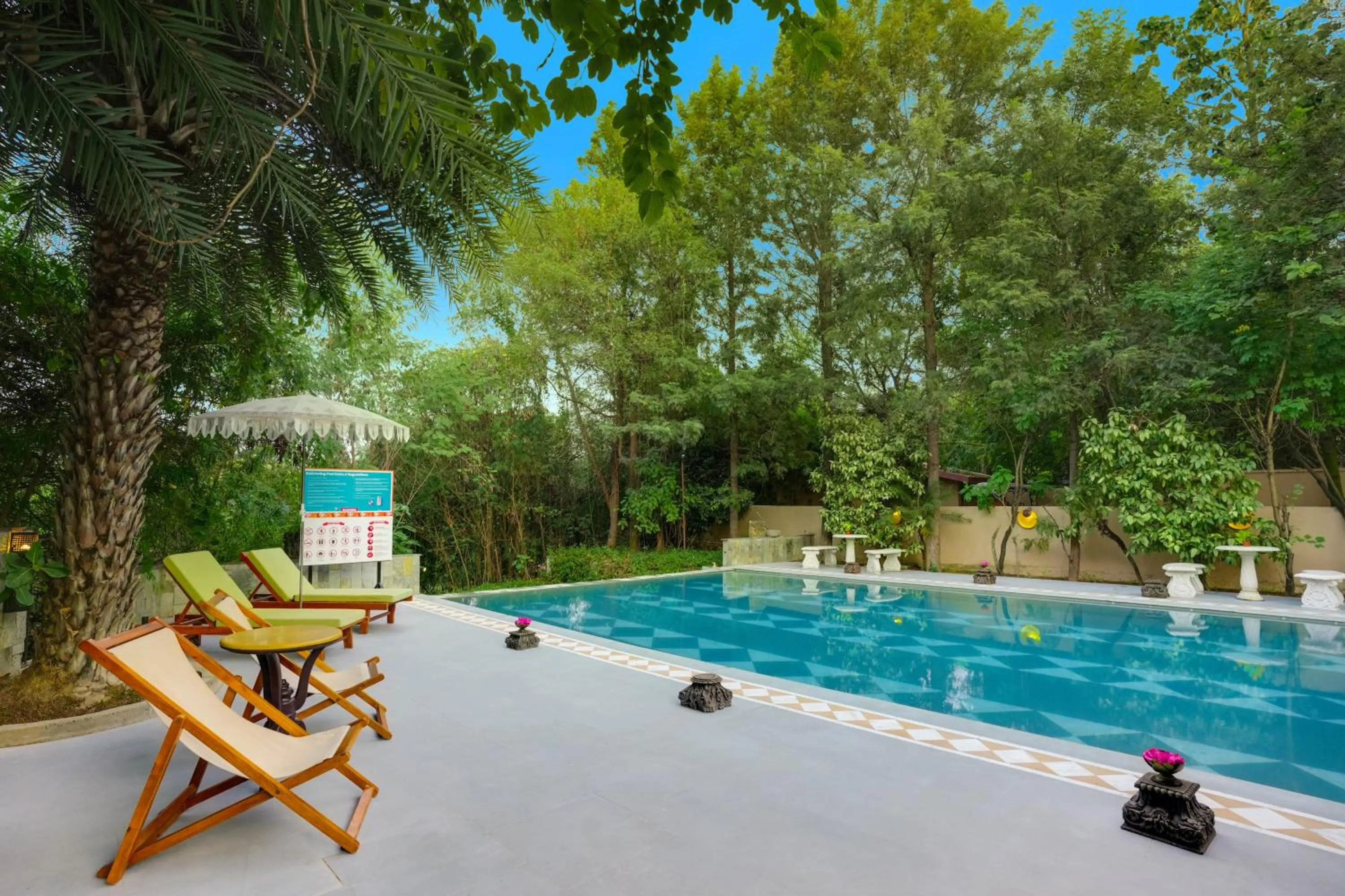 Swimming pool in The Tree House Resort, A Club Mahindra Associate