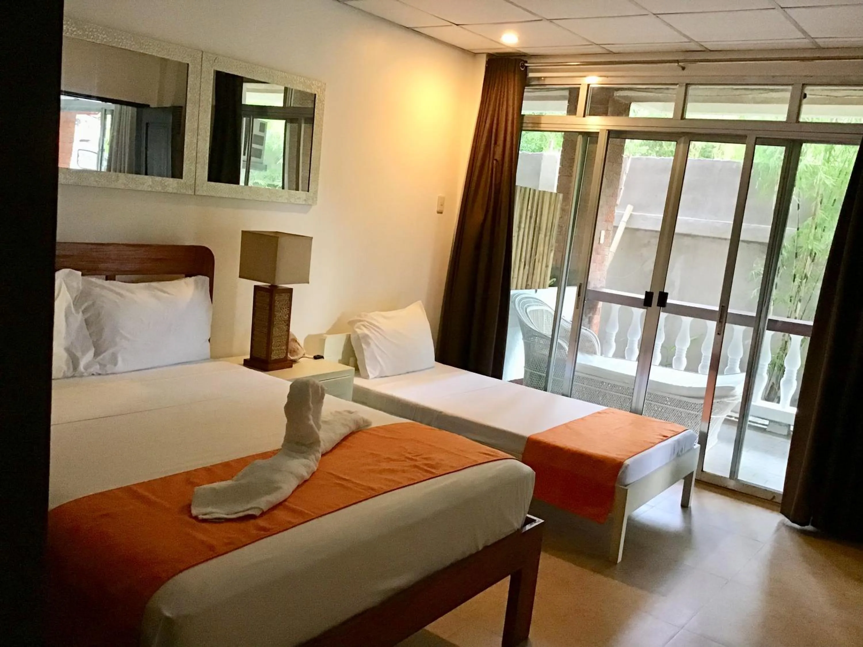 Bed in 1888 Beach Resort