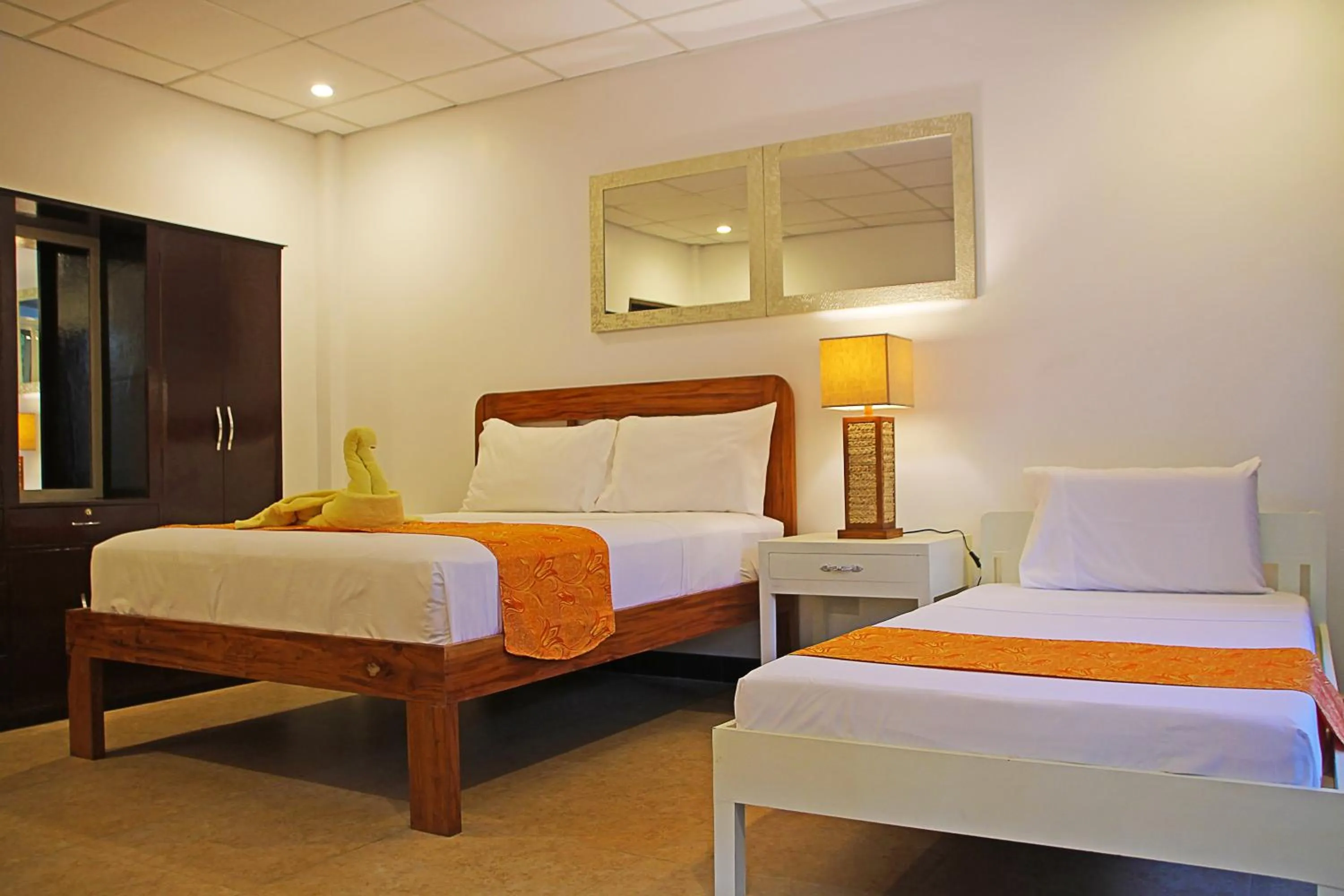 Bed in 1888 Beach Resort