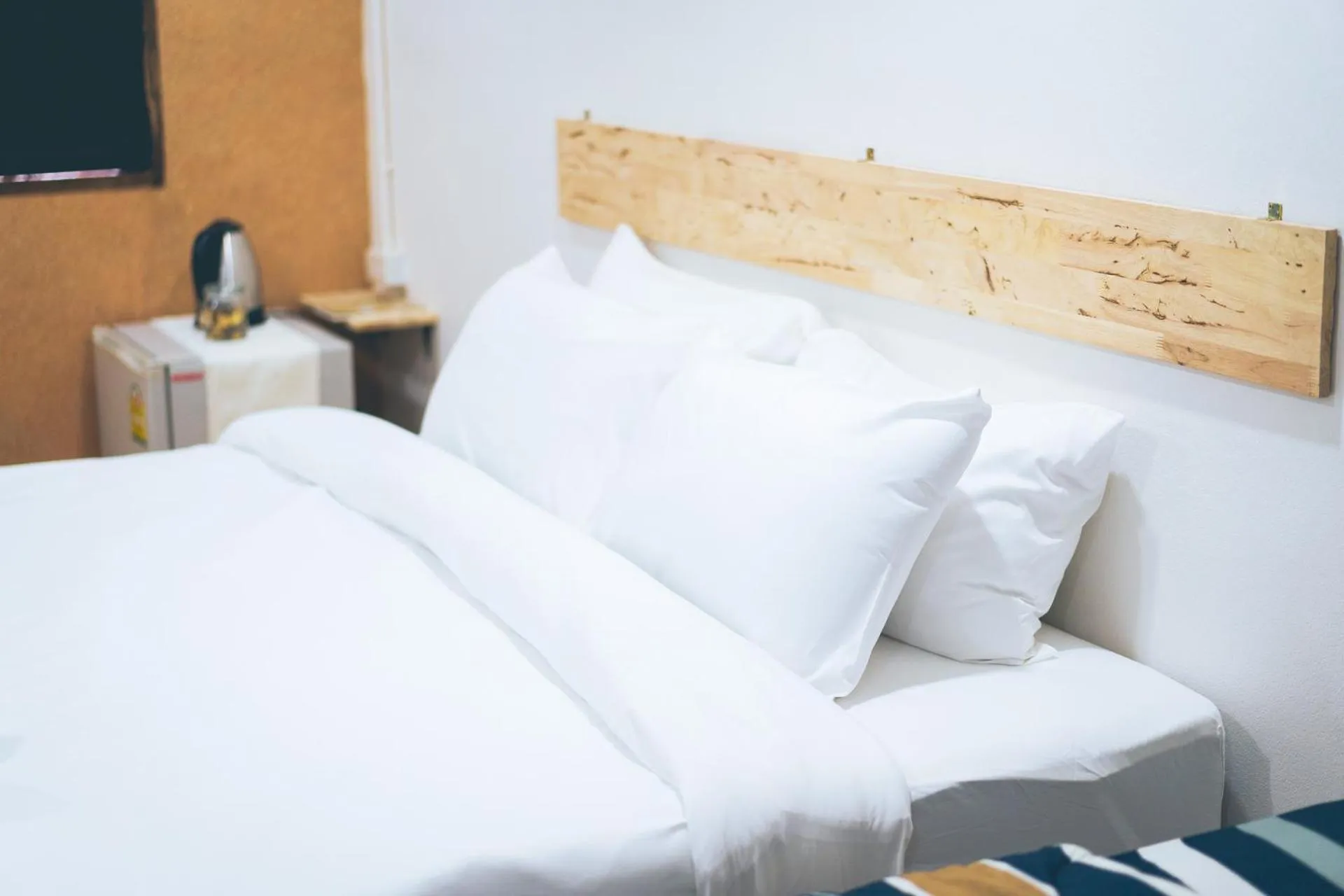 Bed in Wang Jai Kwang Space Inn