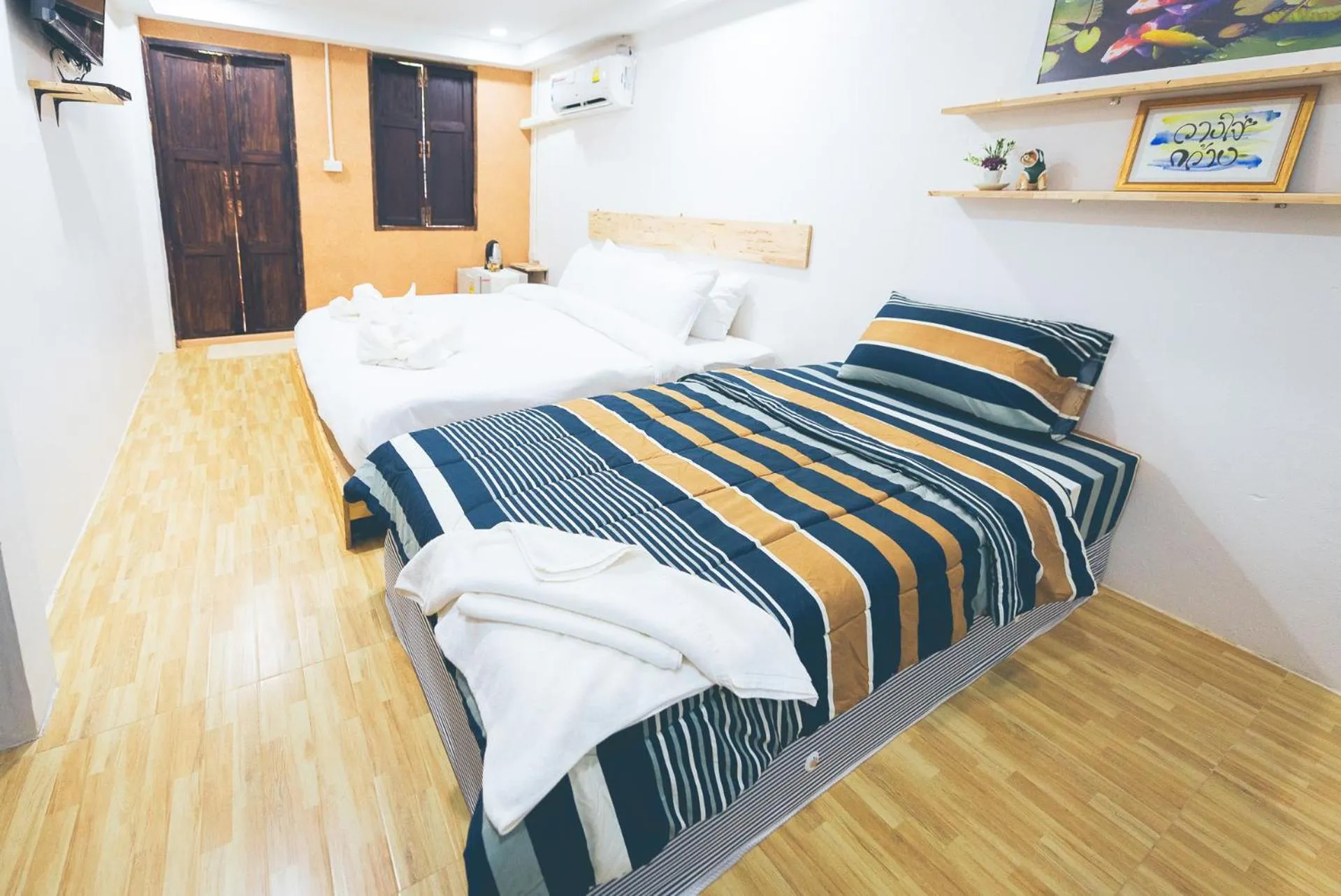 Bed in Wang Jai Kwang Space Inn