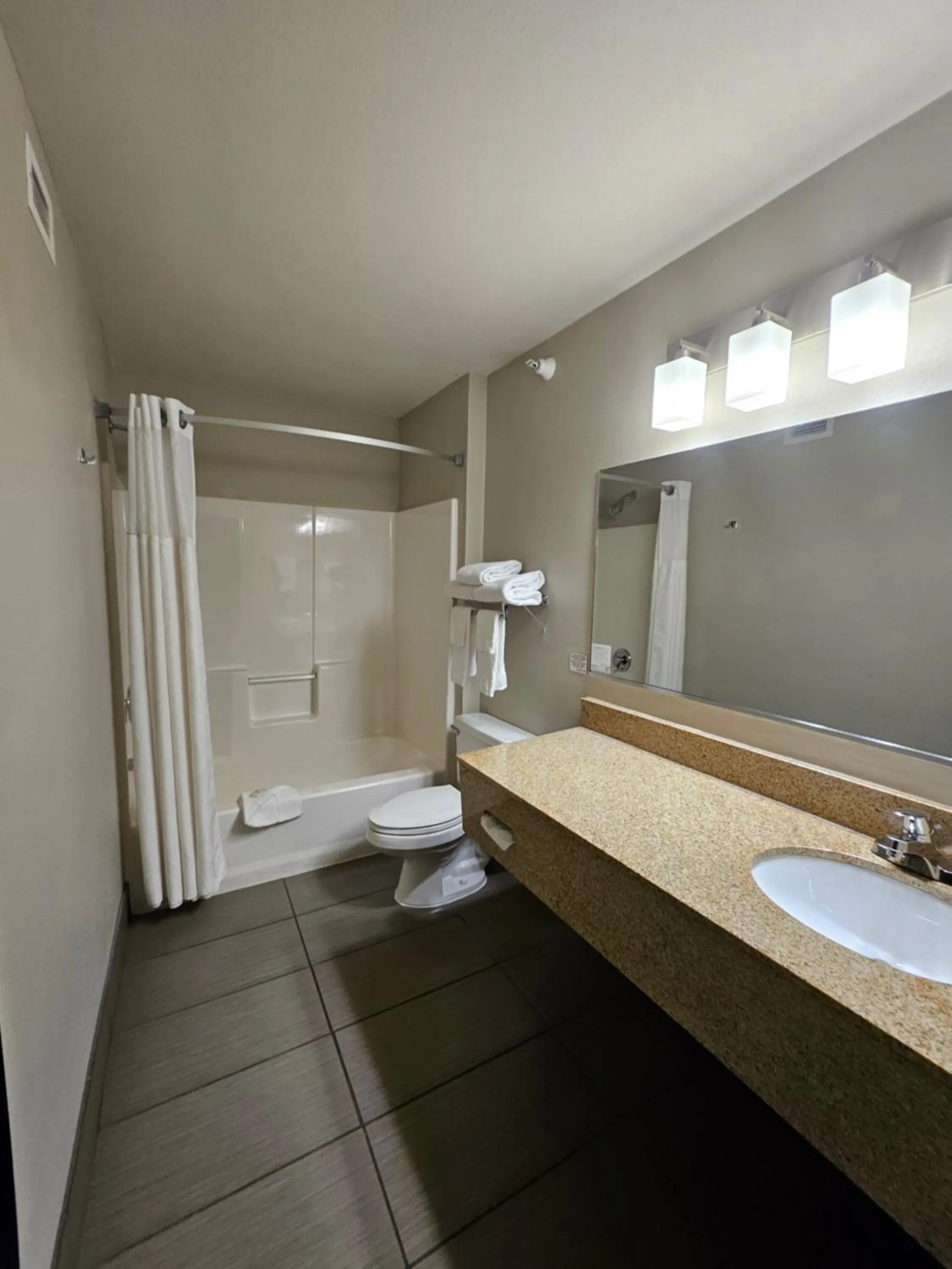 Bathroom in Ramada by Wyndham Platte City KCI Airport