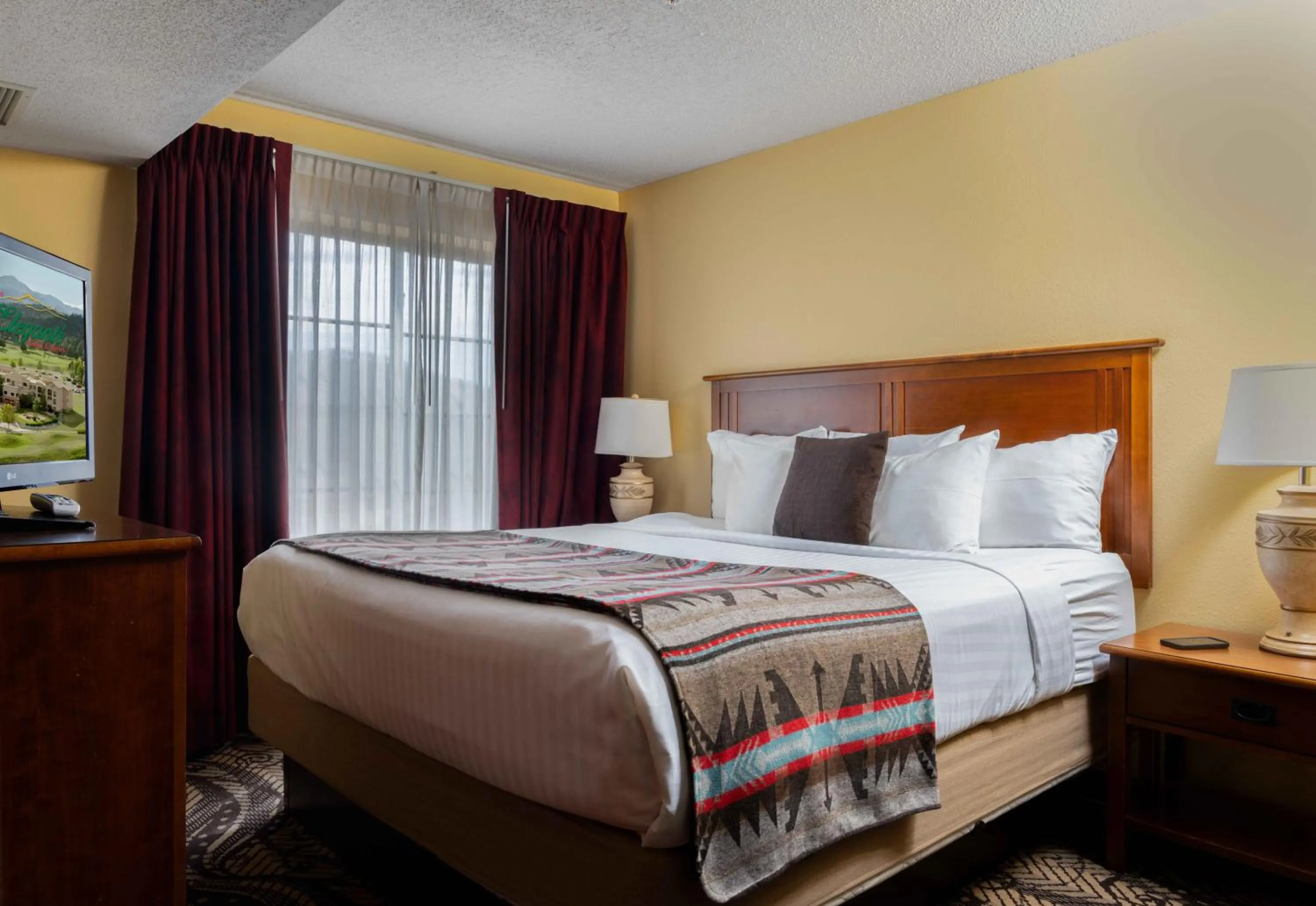 Bed in MCM Elegante Lodge & Resorts