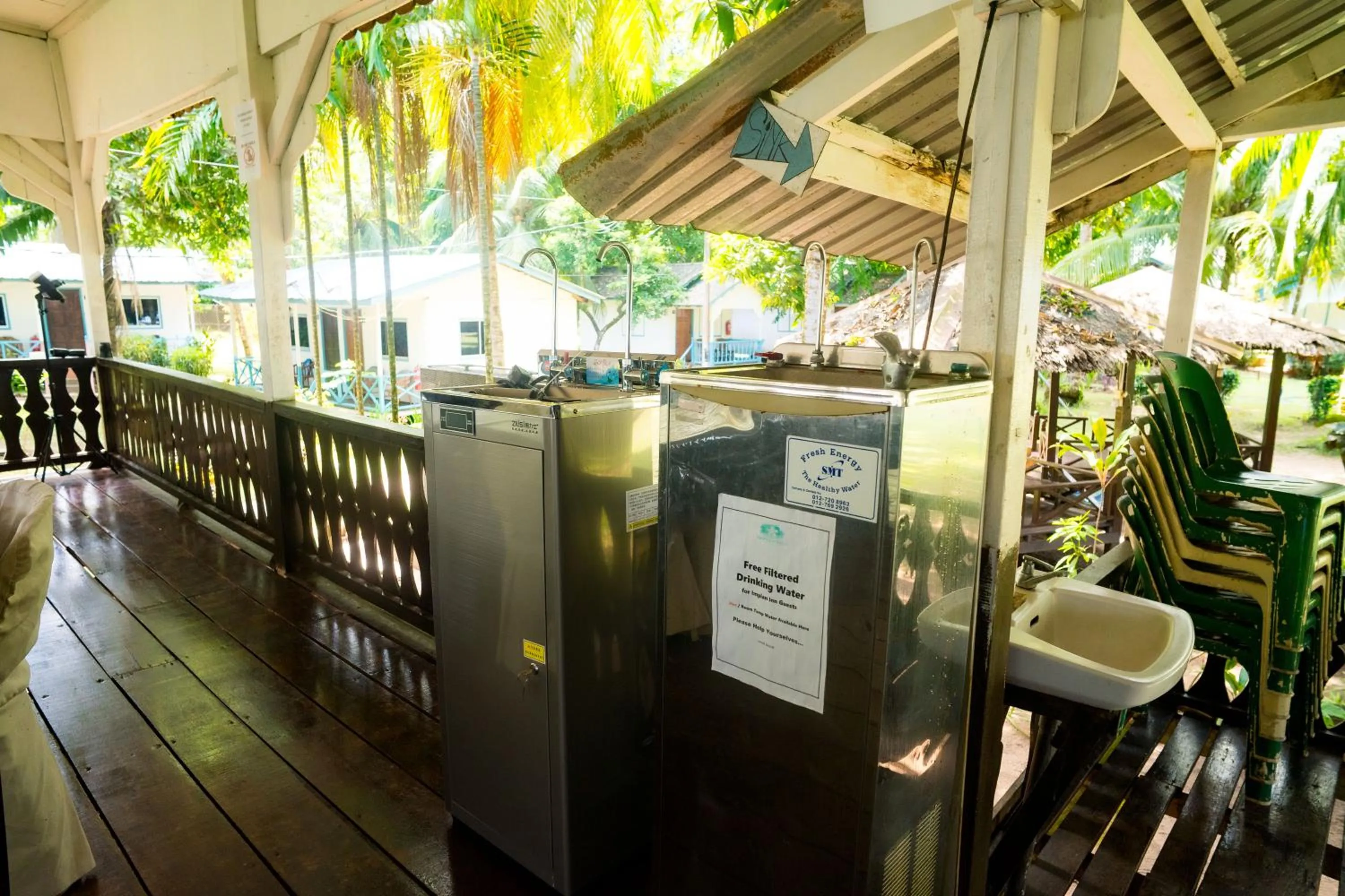 Communal lounge/ TV room in Impian Inn