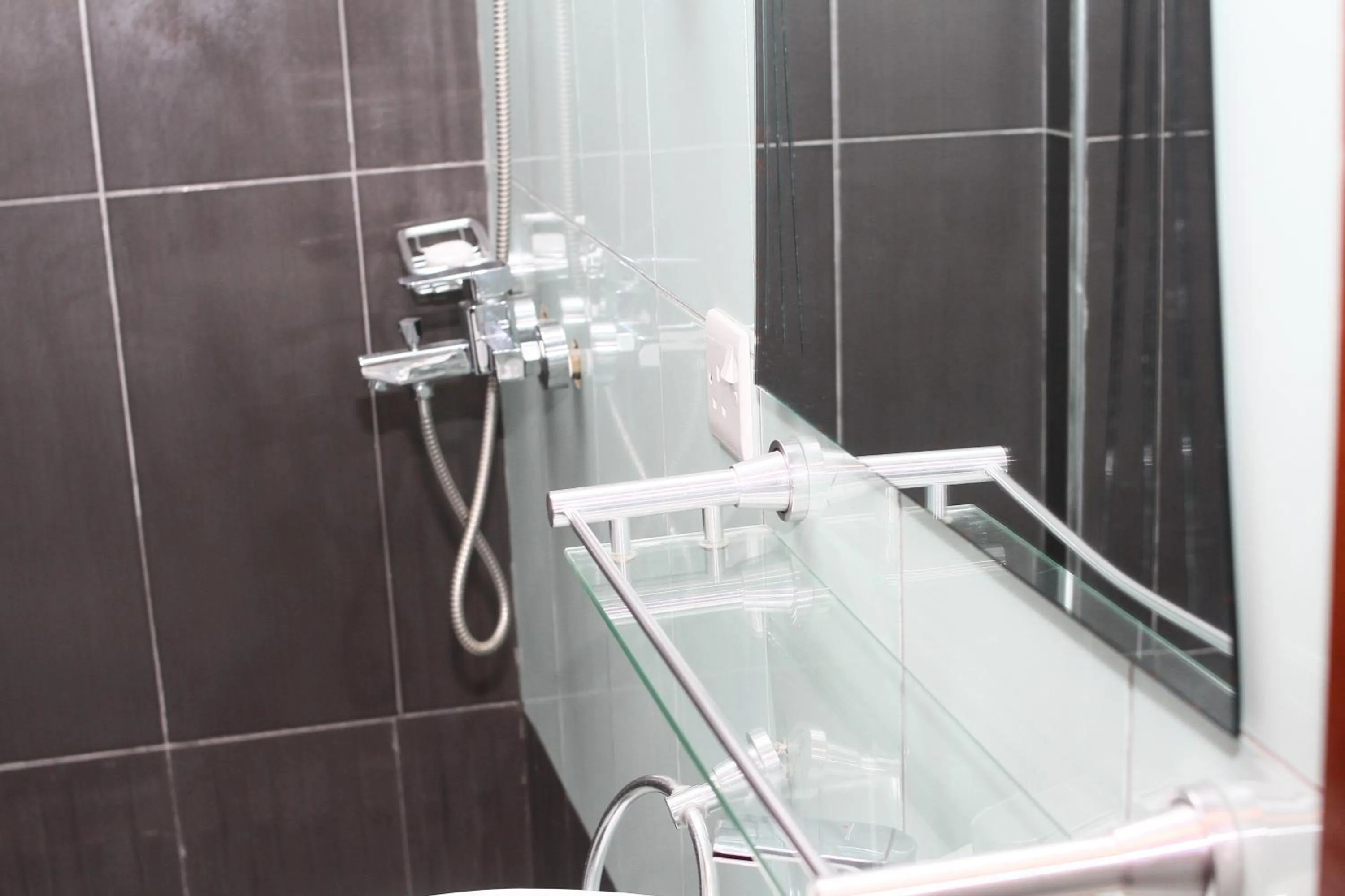 Shower in PLUS 33 HOTEL