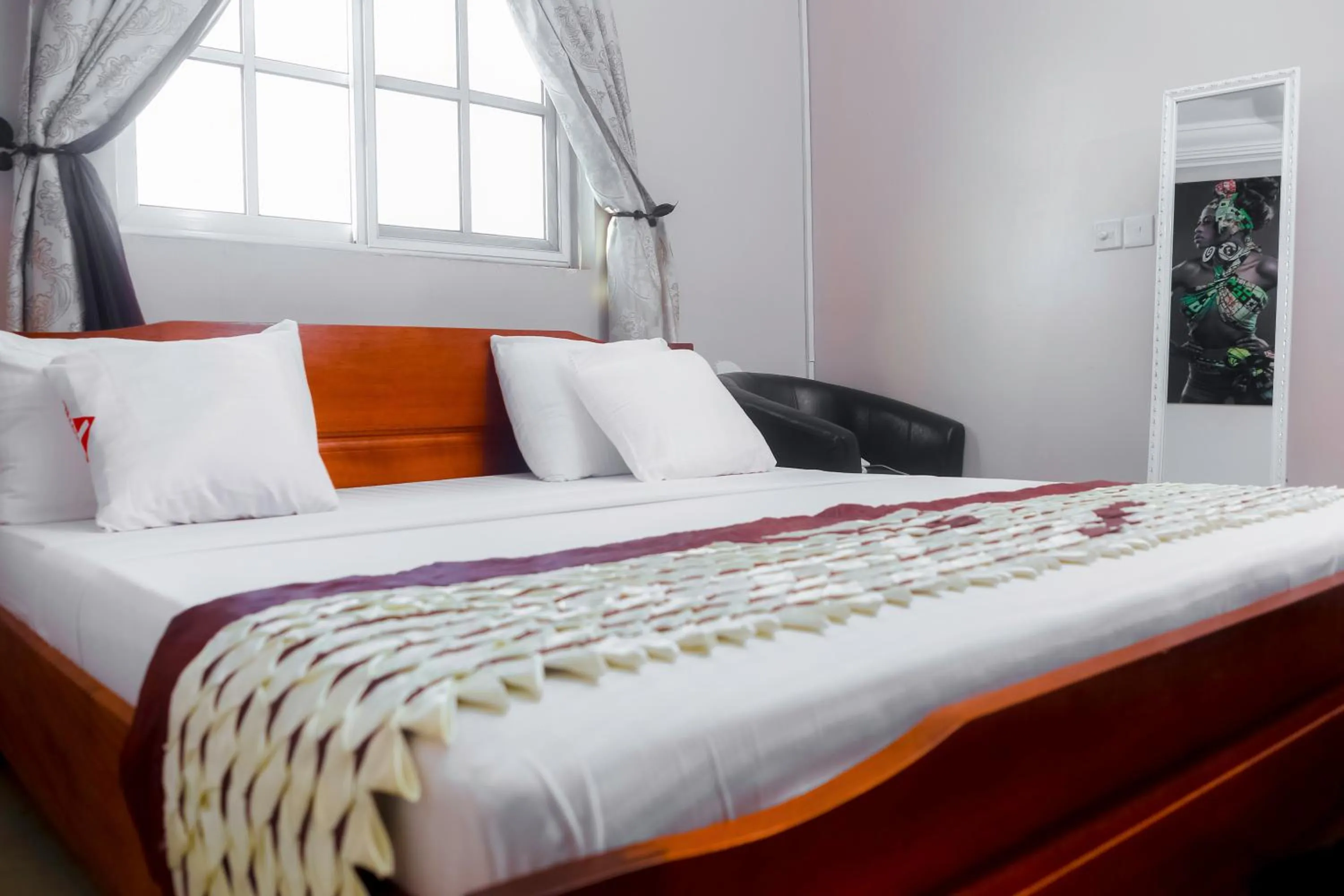 Bed in PLUS 33 HOTEL