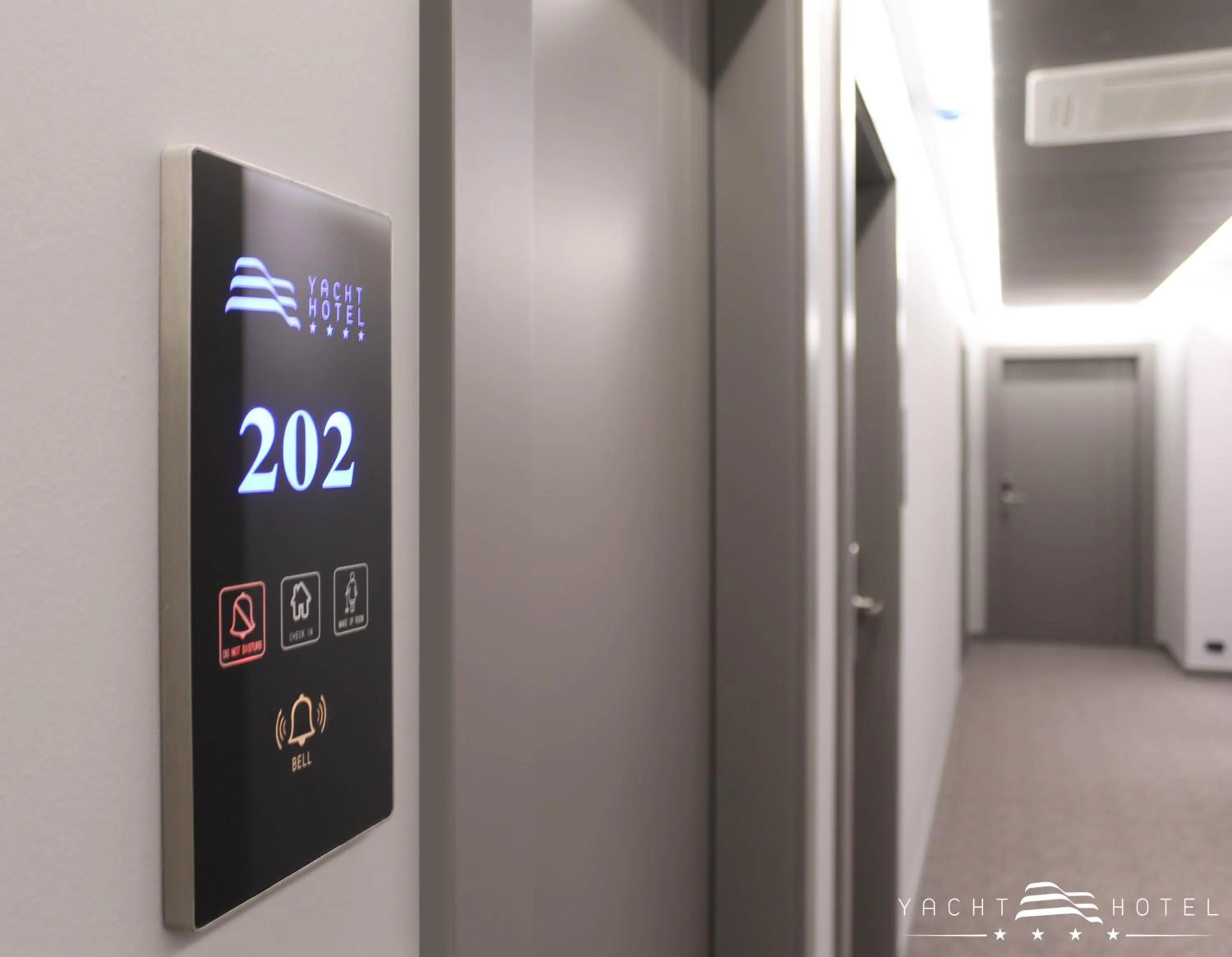 Property logo or sign in Yacht Hotel