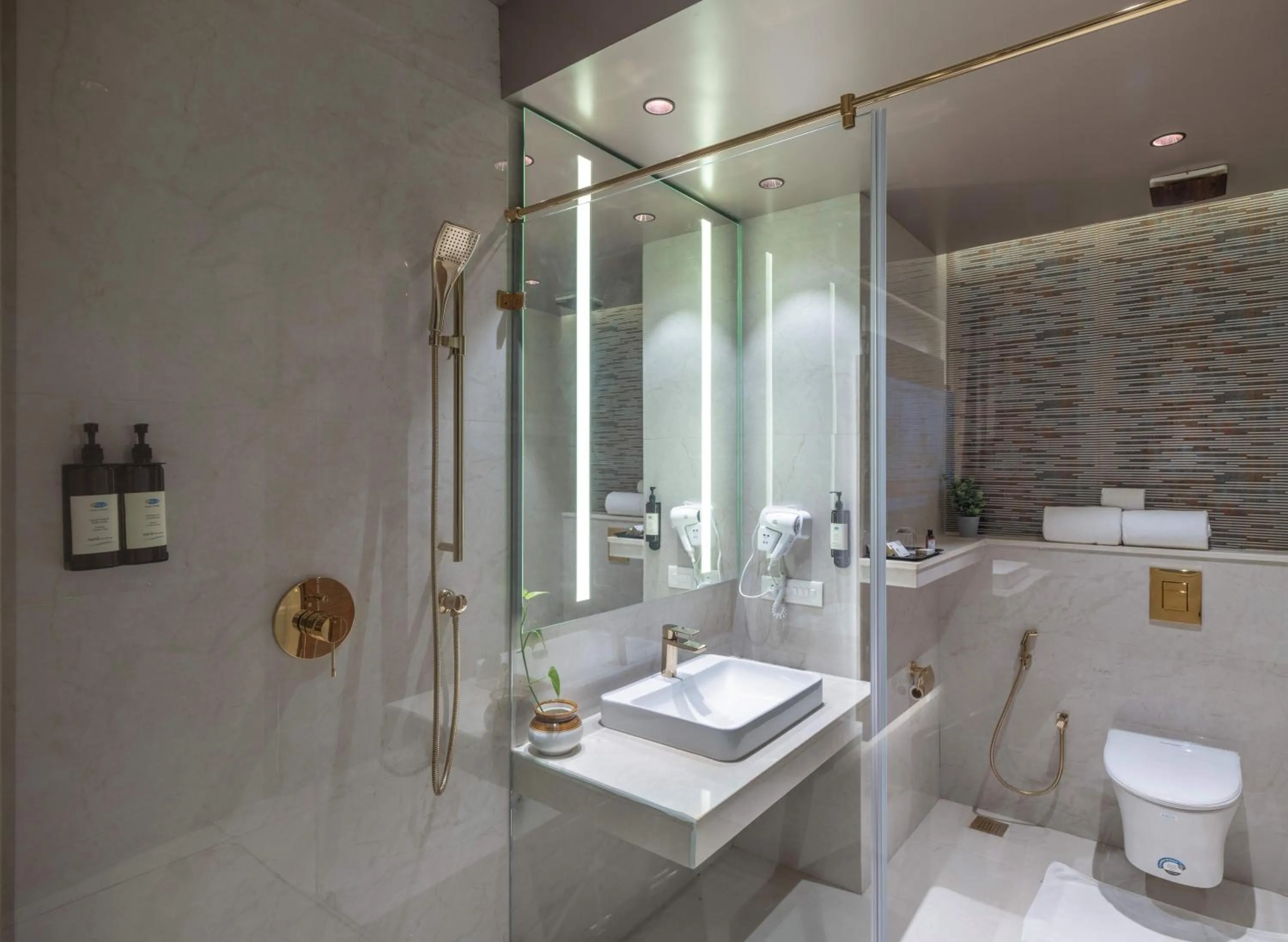 Bathroom in Uday Suites - The Airport Hotel