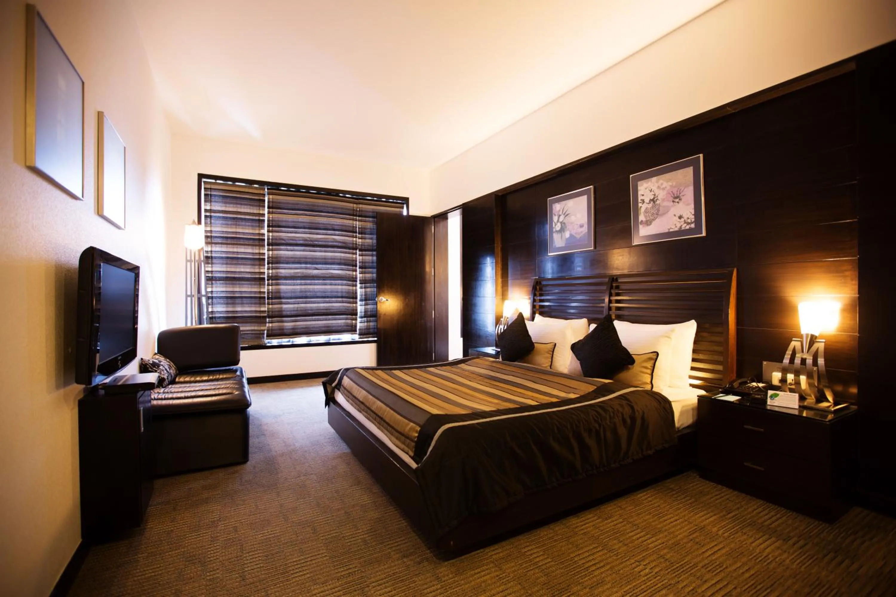 Photo of the whole room, Bed in E-Square The Fern Pune, Series by Marriott