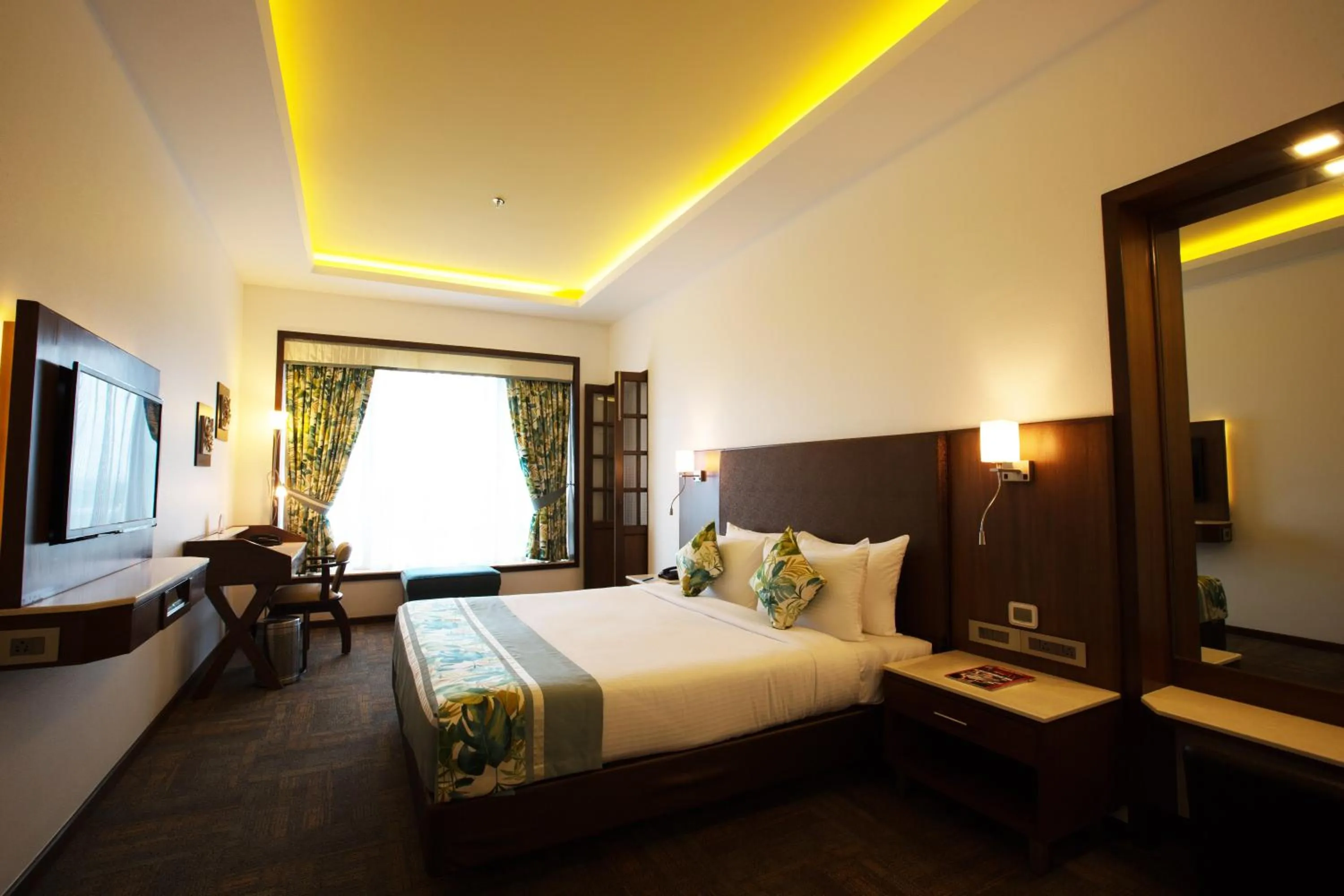 Photo of the whole room, Bed in E-Square The Fern Pune, Series by Marriott