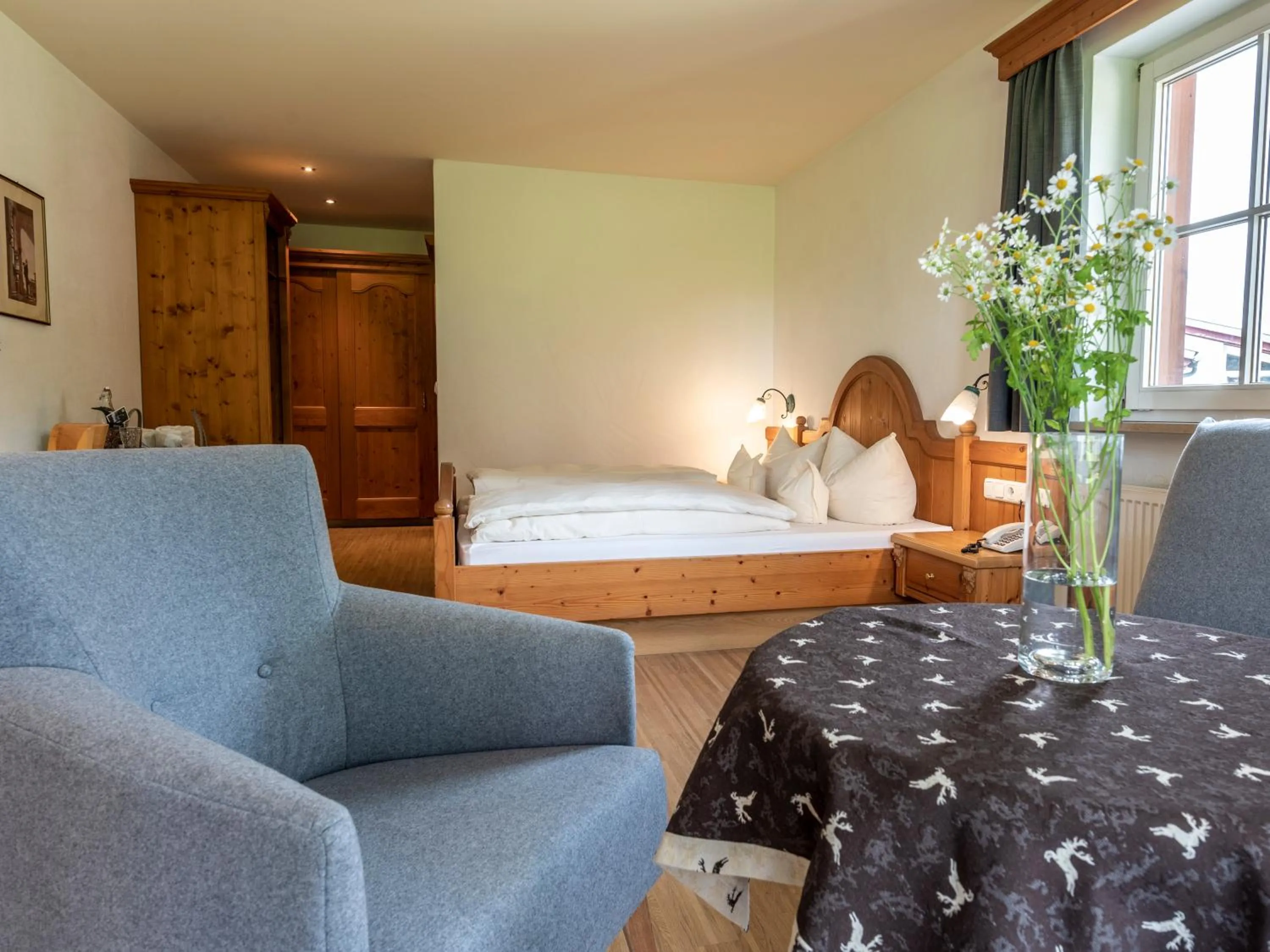 Seating area, Bed in Naturhotel Lärchenhof