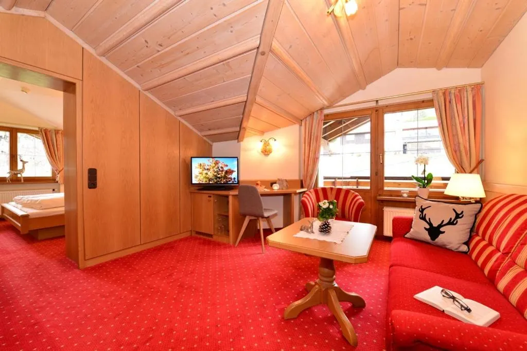 Living room, Bed in Hotel Jagdhof