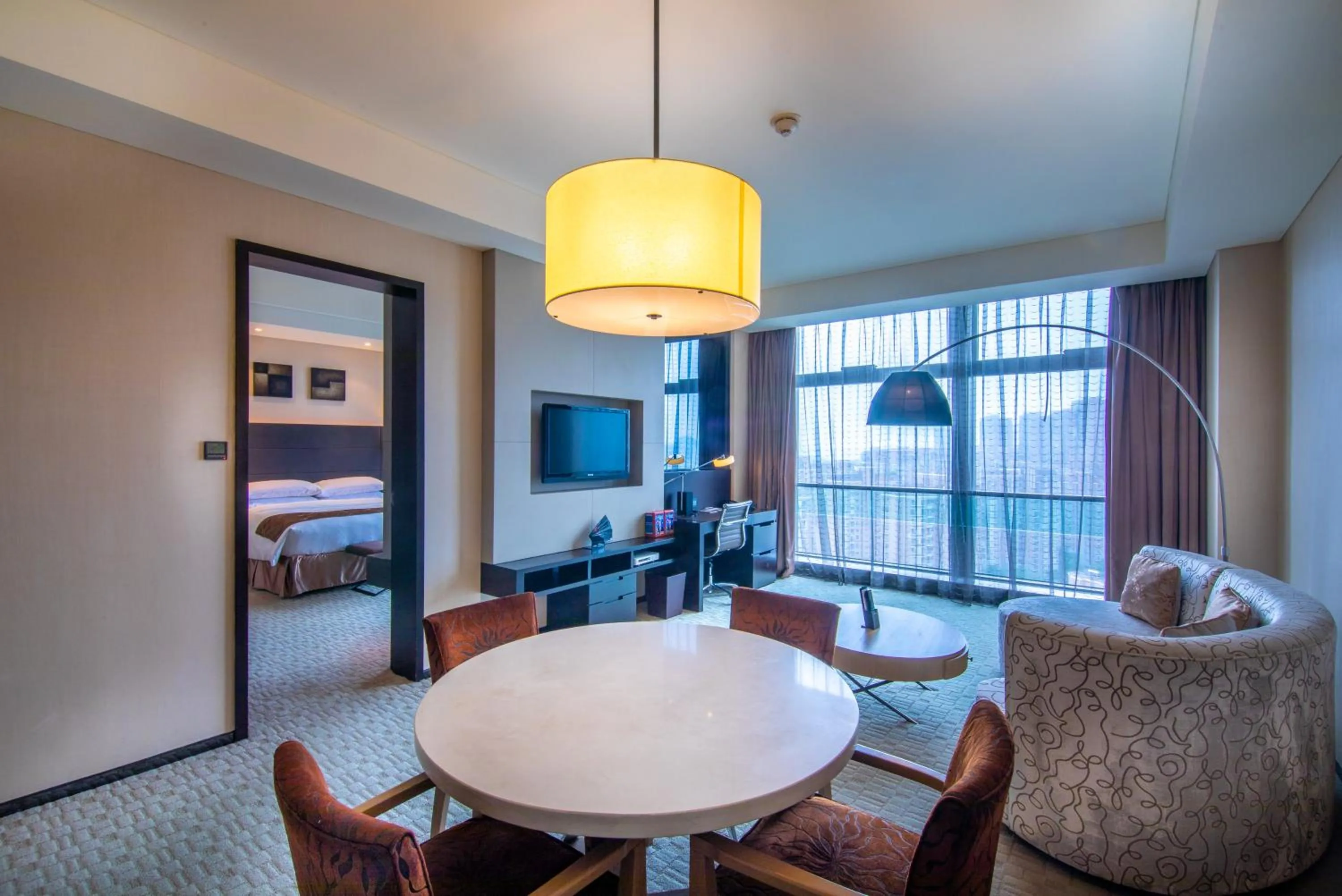 Living room, Bed in Renaissance Guiyang Hotel
