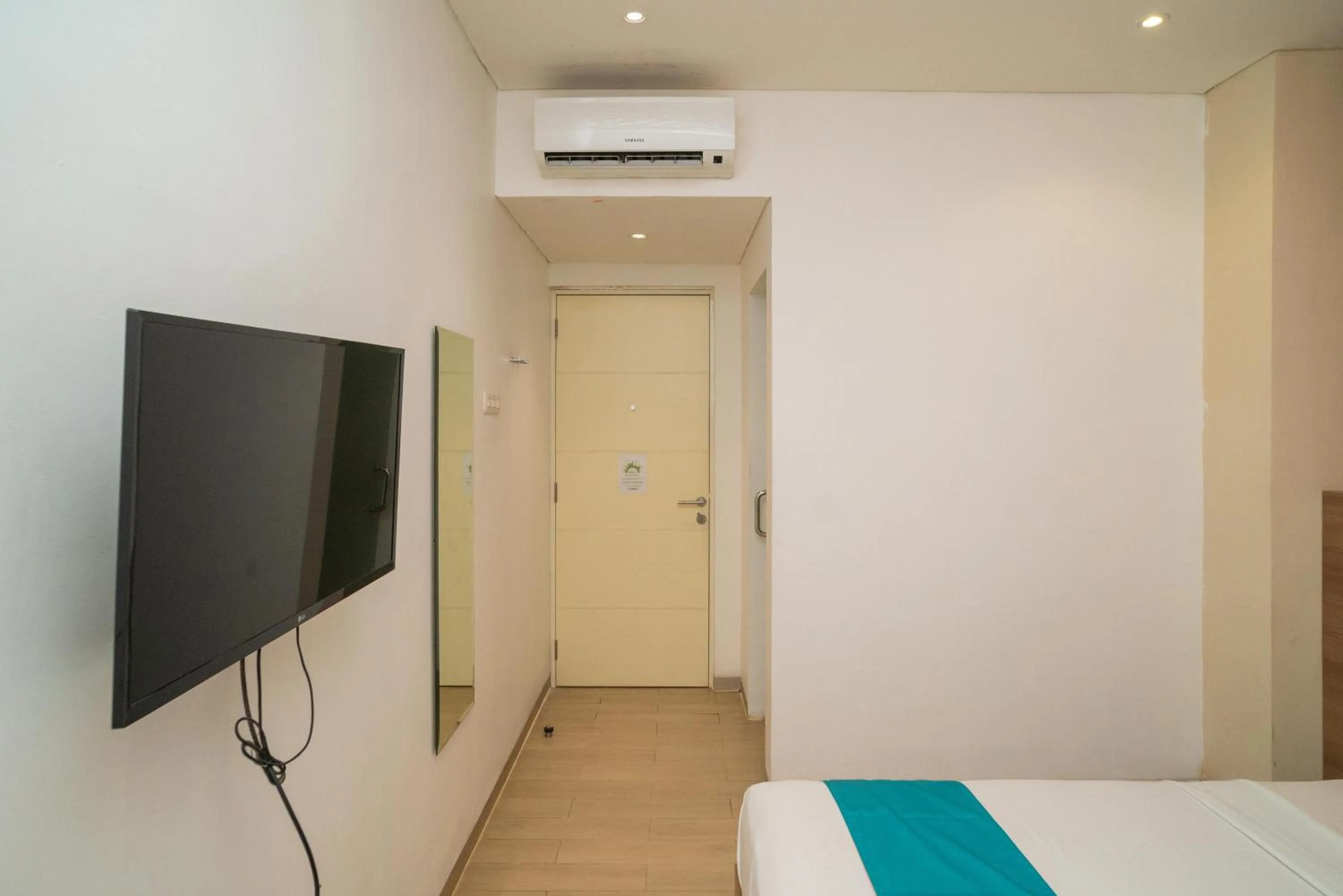 Bedroom, Bed in Sans Hotel Kupang Indah Surabaya