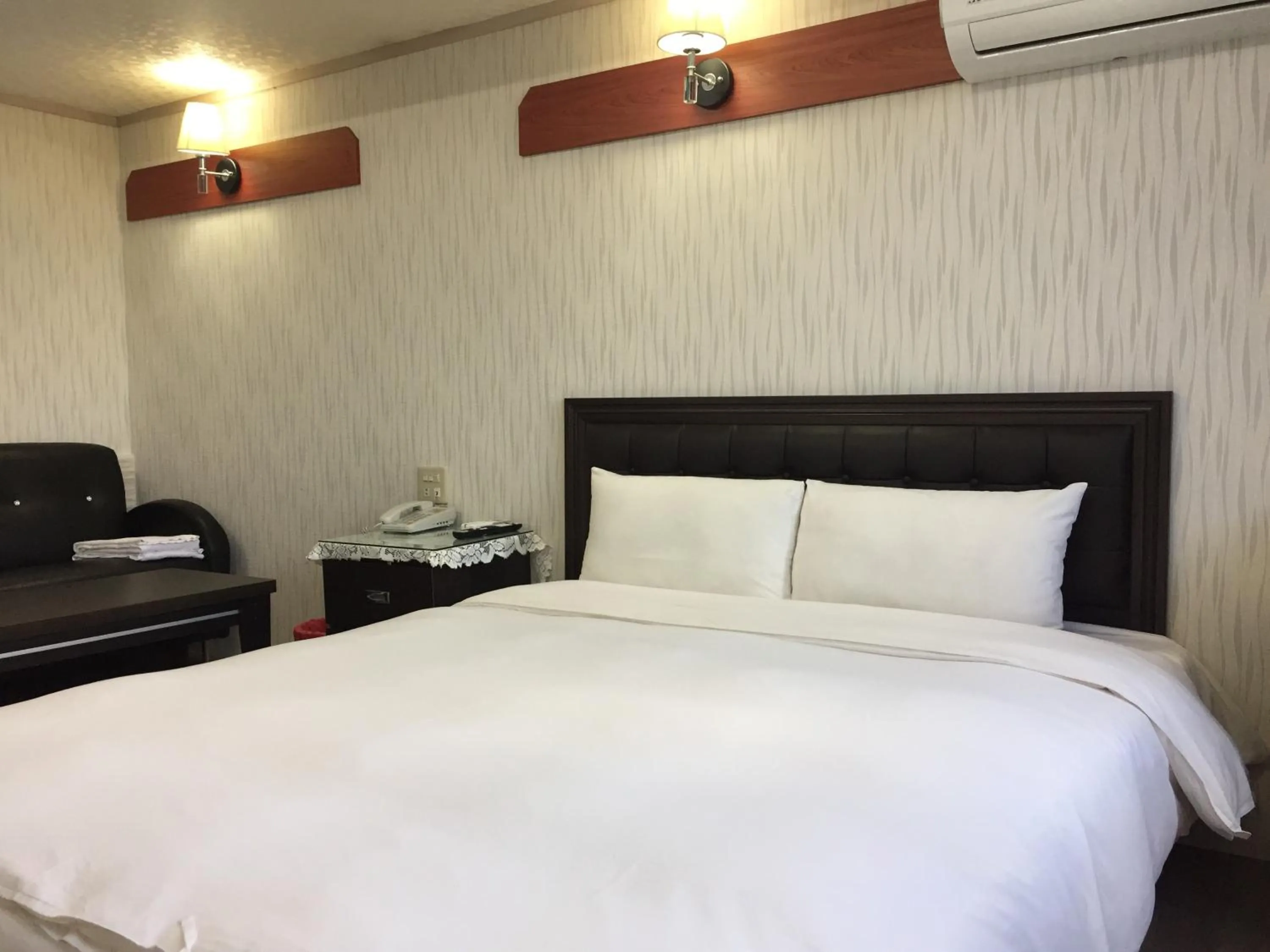 Bed in King Lo Tung Hotel