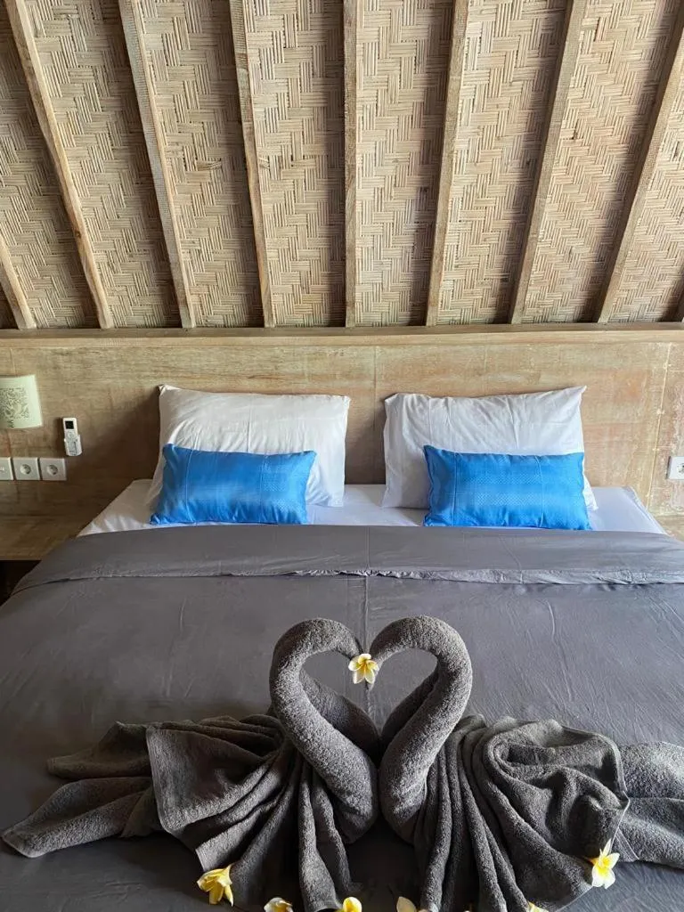 Bed in Kuri Garden Cottage