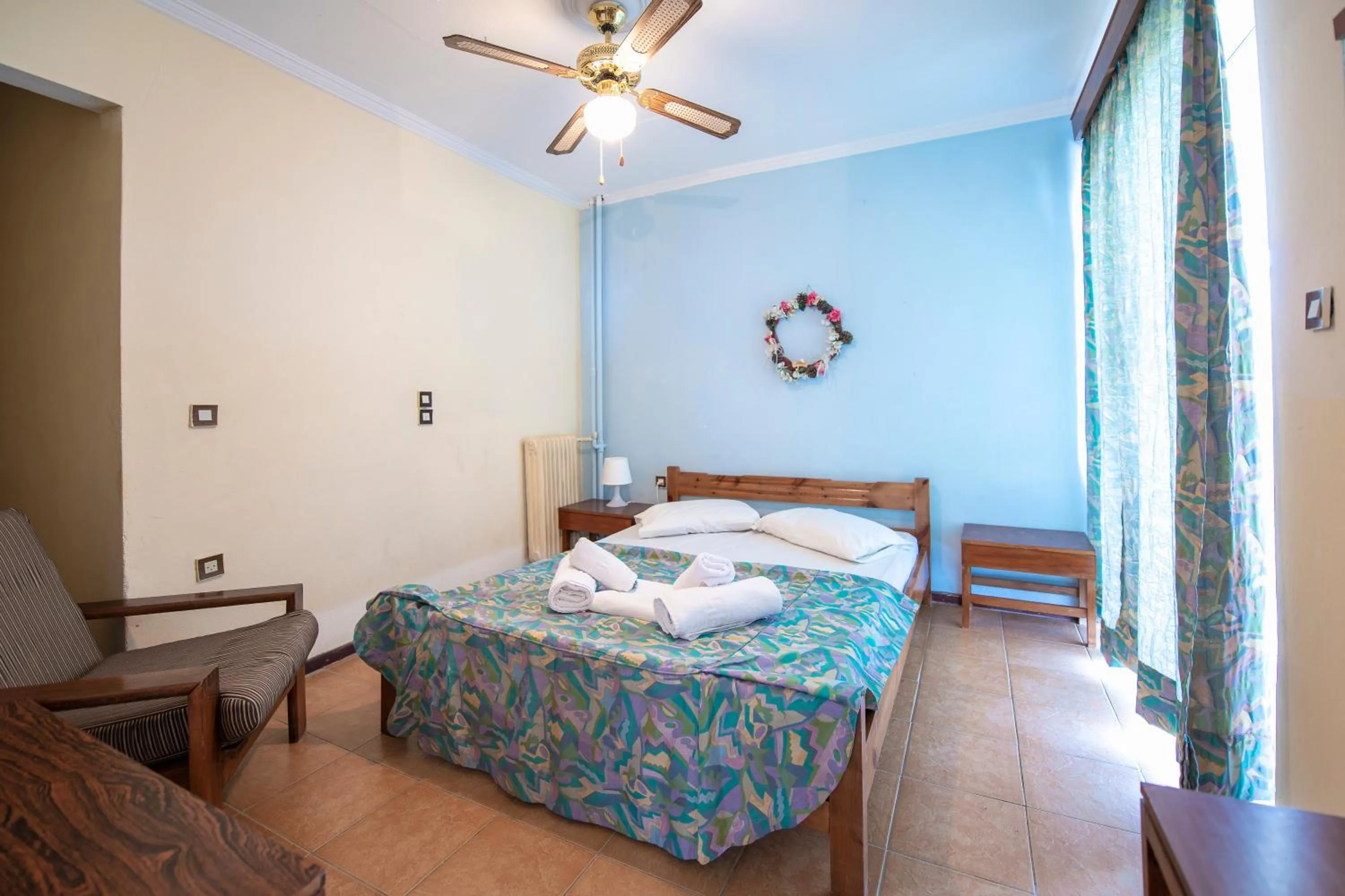 Bed in SUN HOTEL KINETA Beach Front