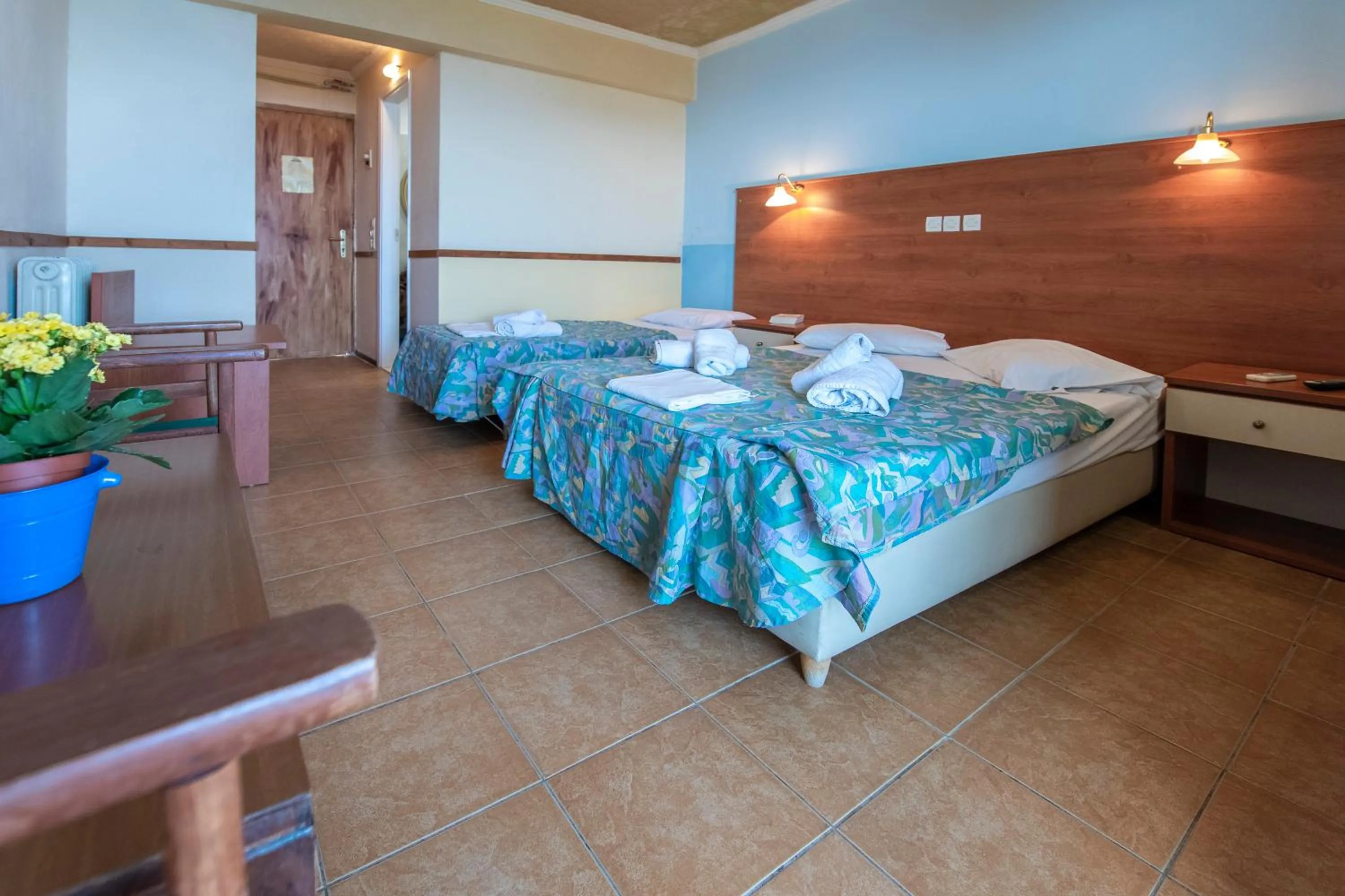 Bed in SUN HOTEL KINETA Beach Front