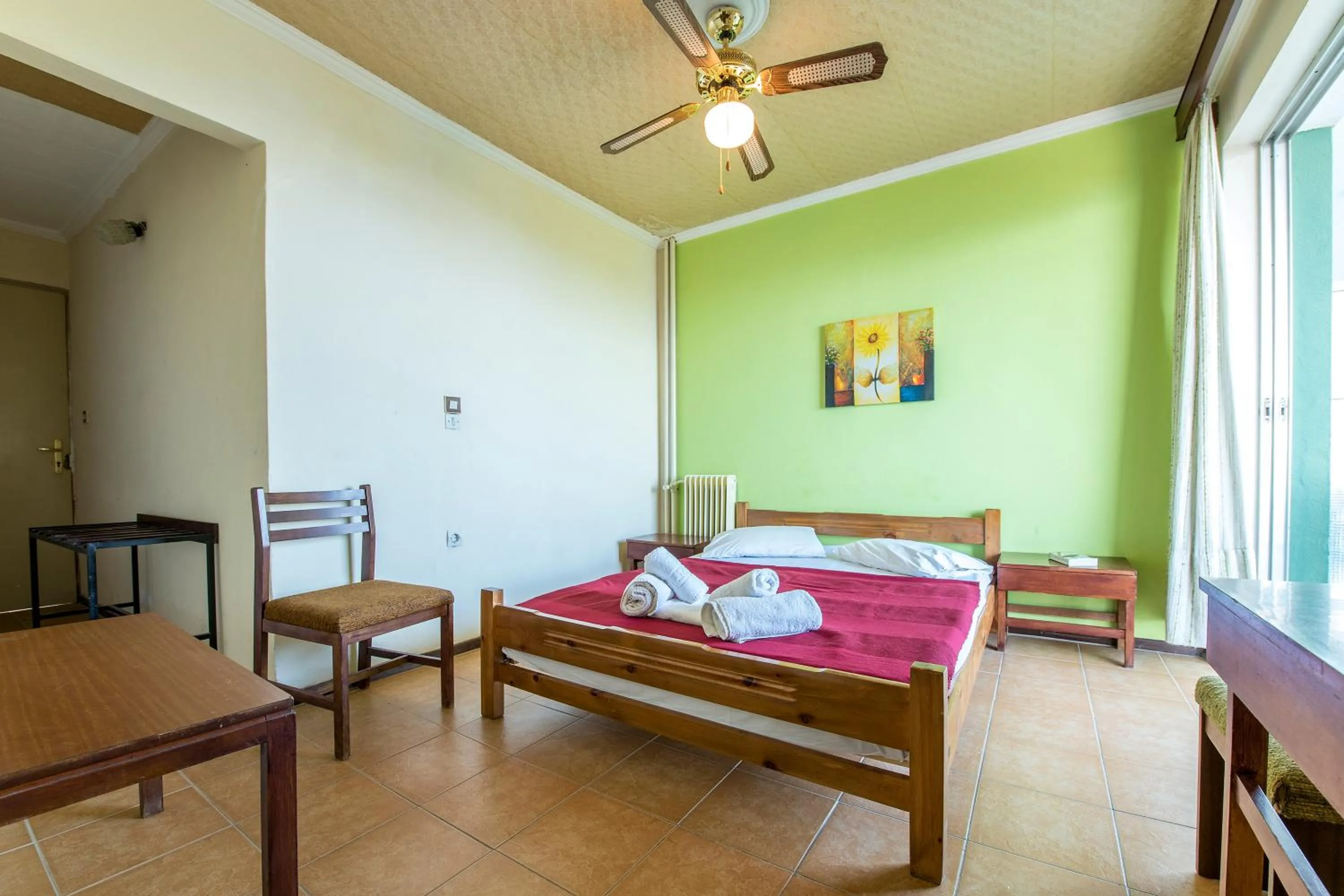 Bed in SUN HOTEL KINETA Beach Front