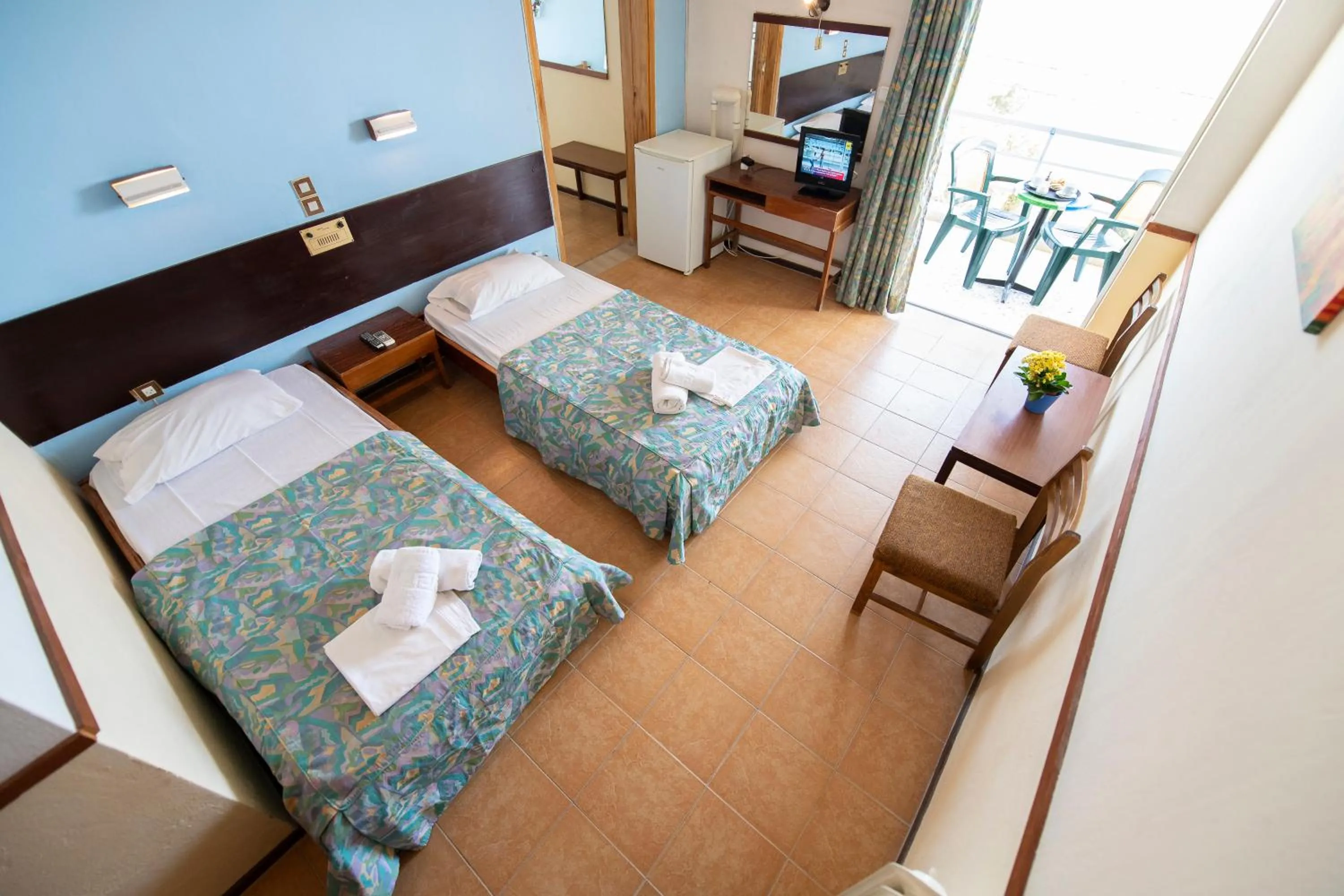 Bed in SUN HOTEL KINETA Beach Front