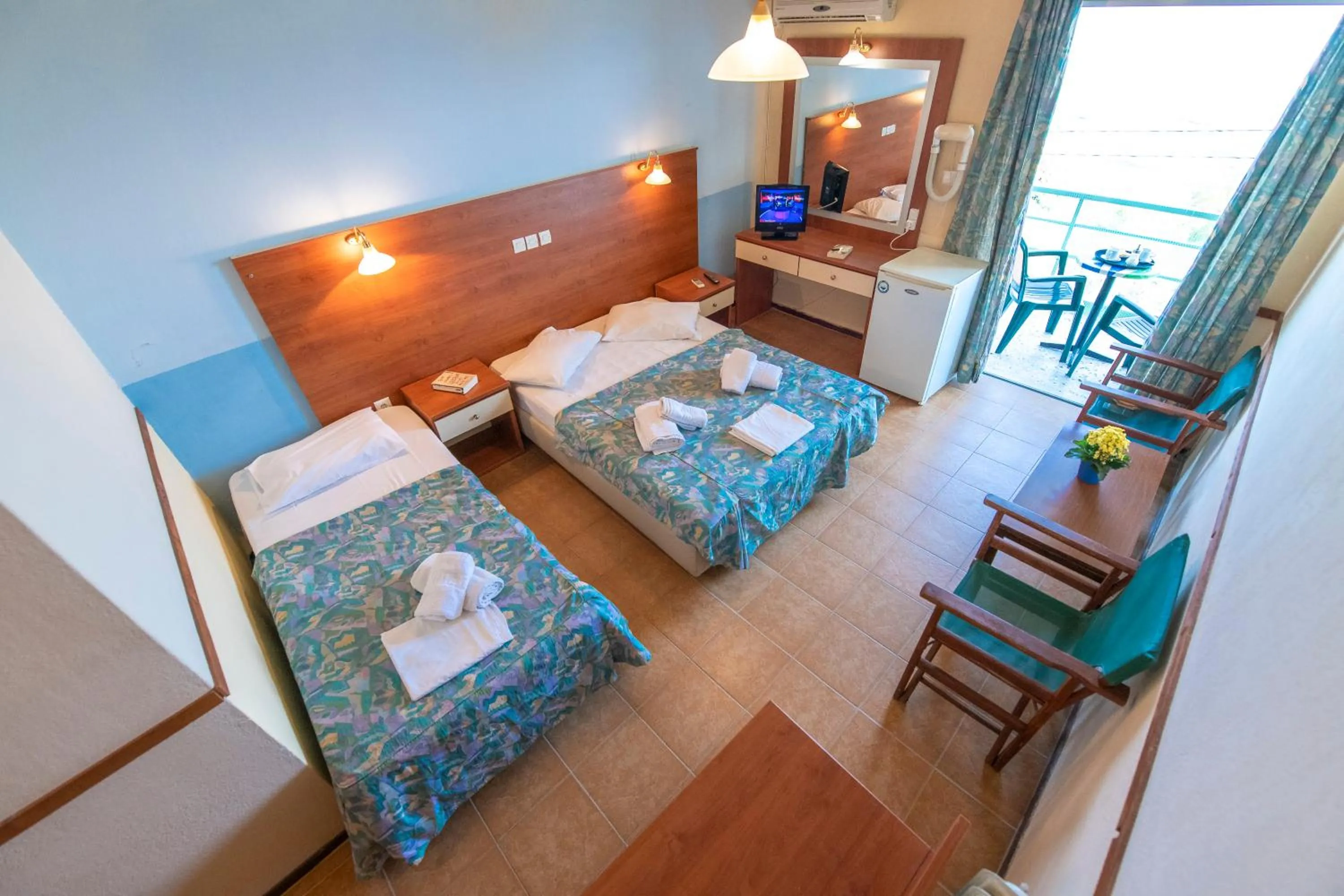 Bed in SUN HOTEL KINETA Beach Front