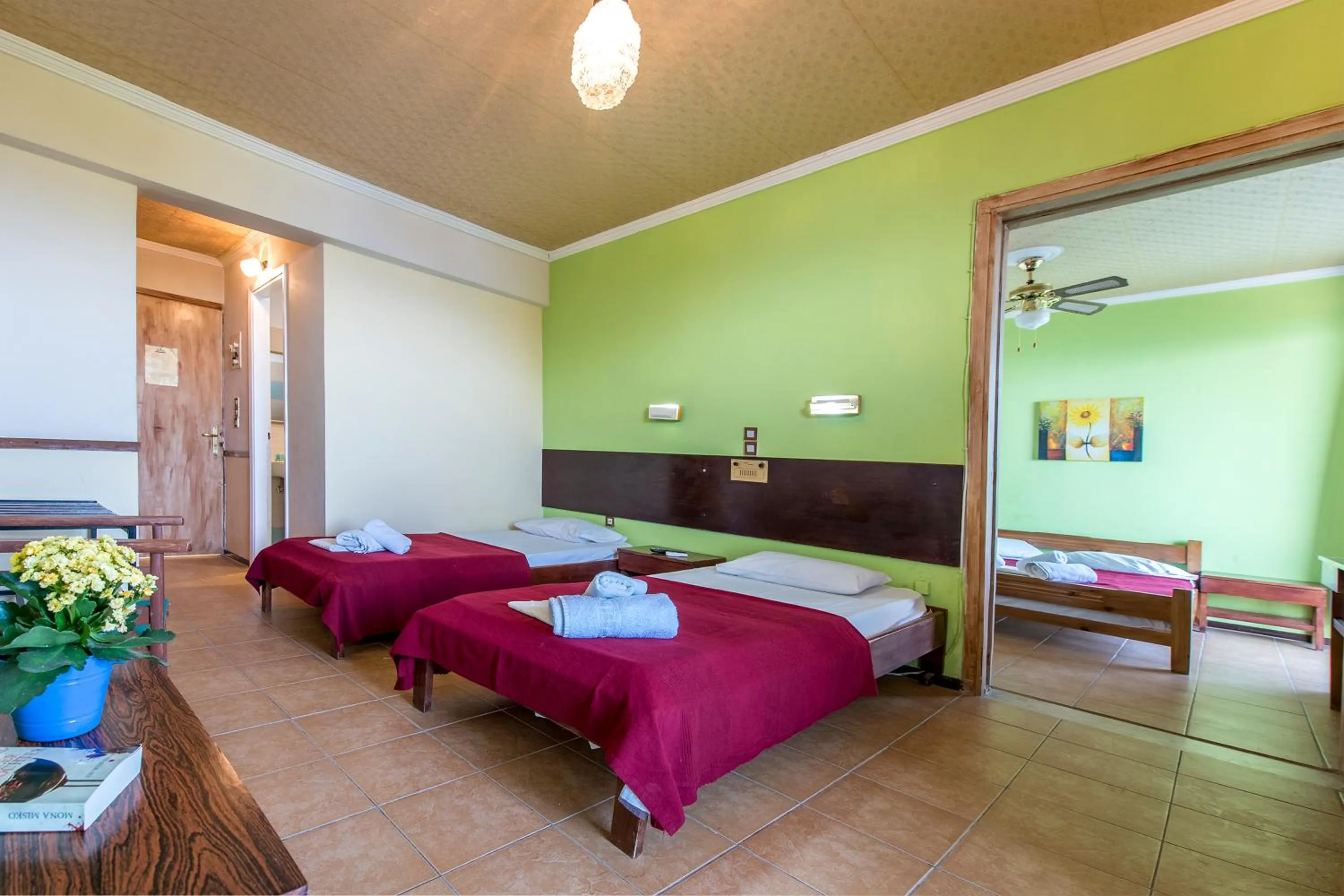 Bed in SUN HOTEL KINETA Beach Front