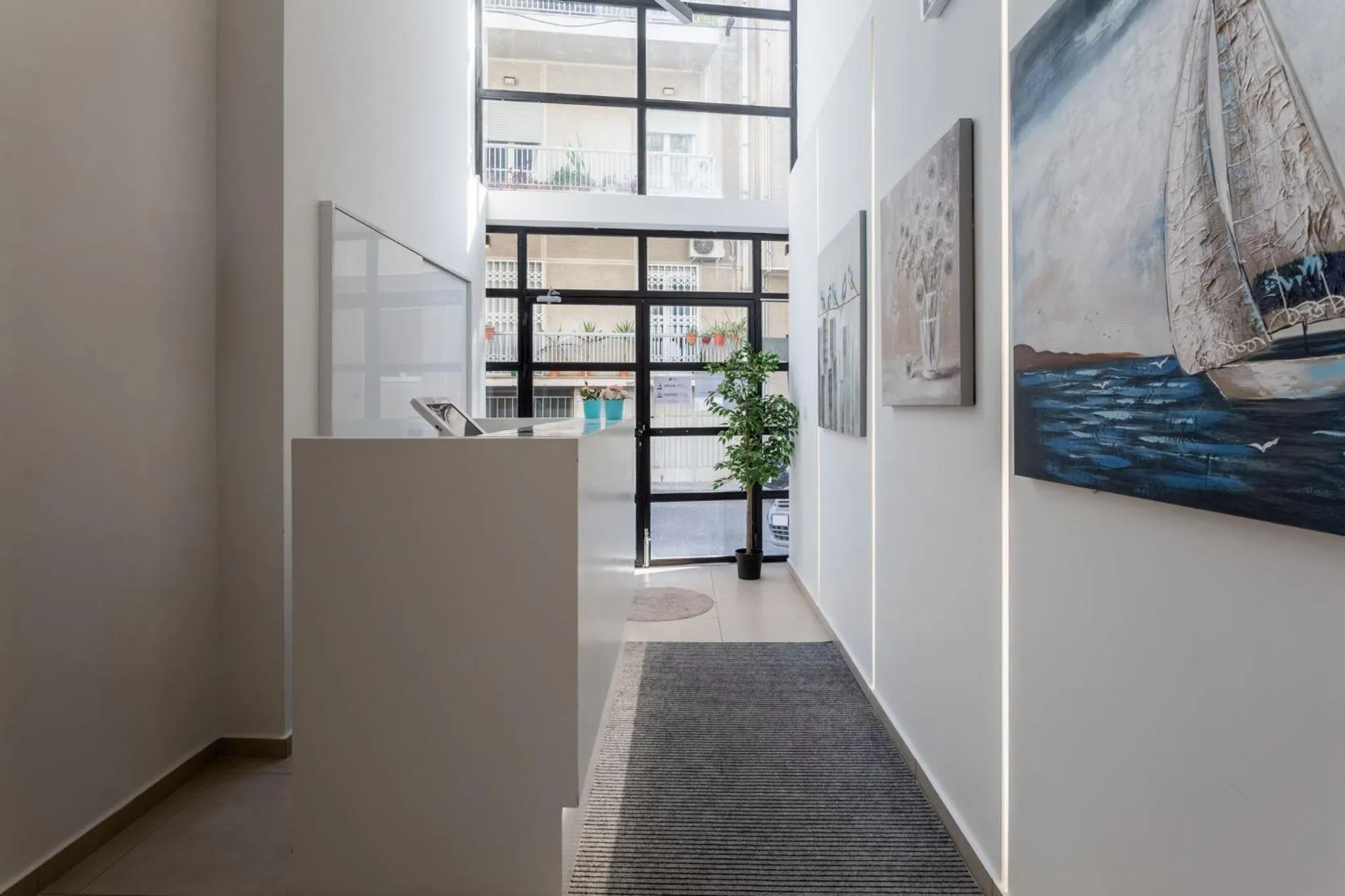 Lobby or reception in Supreme Comfort Apartments by Athens Stay