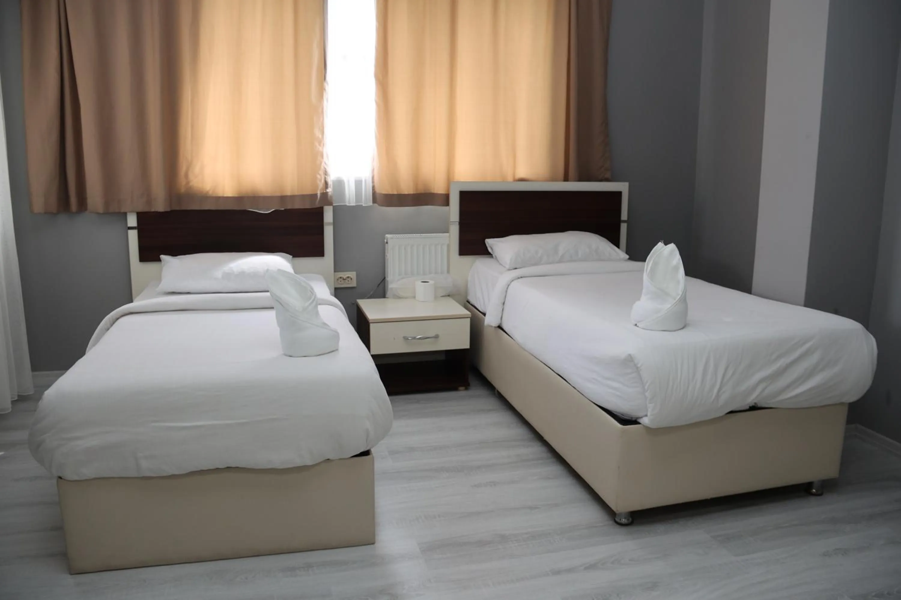 Bed in Grand Koru Hotel Beach