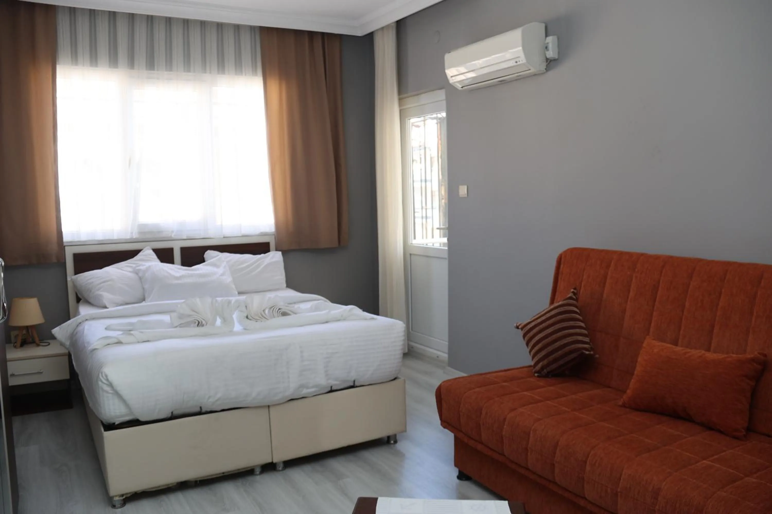 Seating area, Bed in Grand Koru Hotel Beach