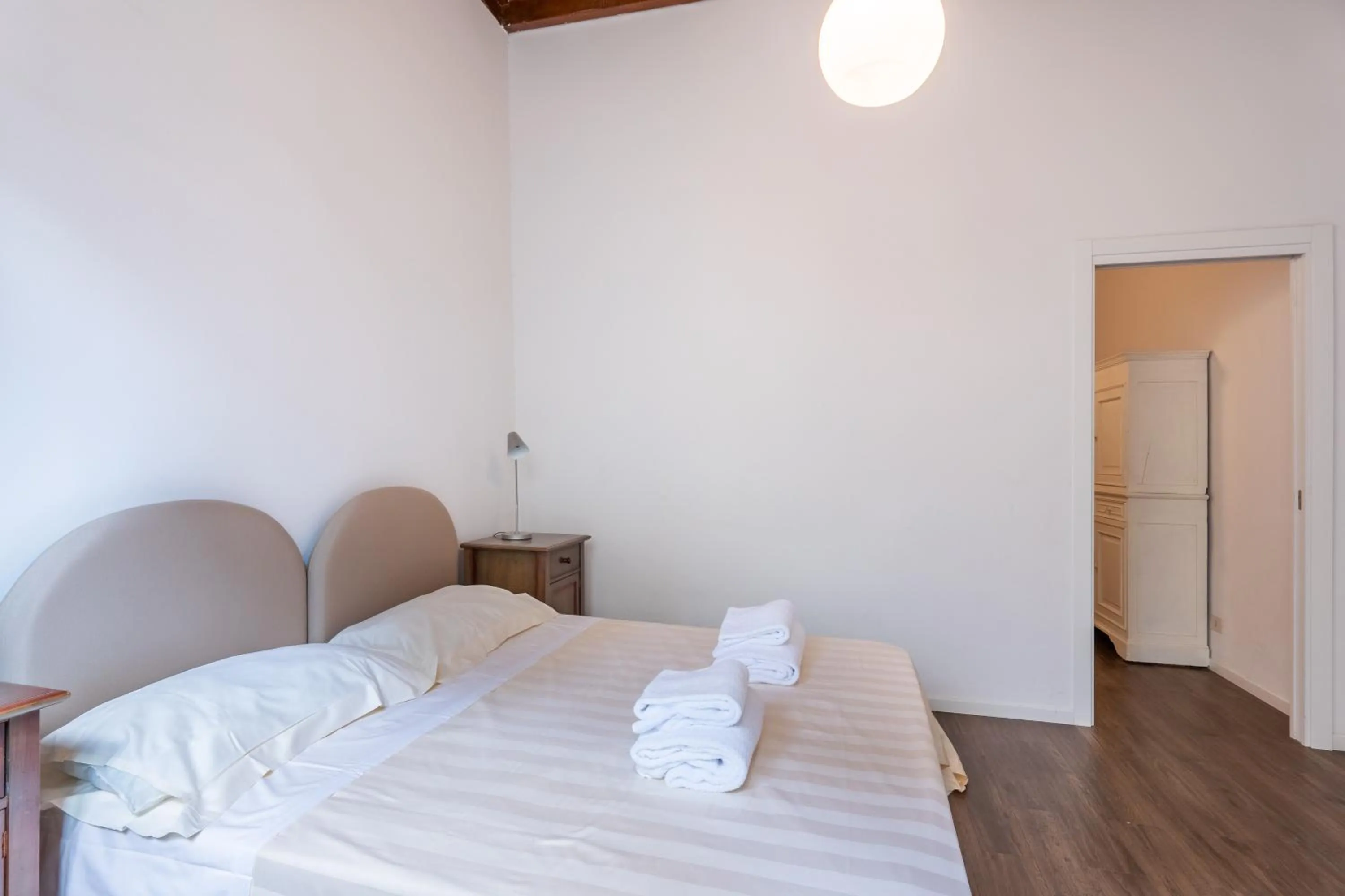 Bed in Palazzo Vecchio Apartments by Mmega