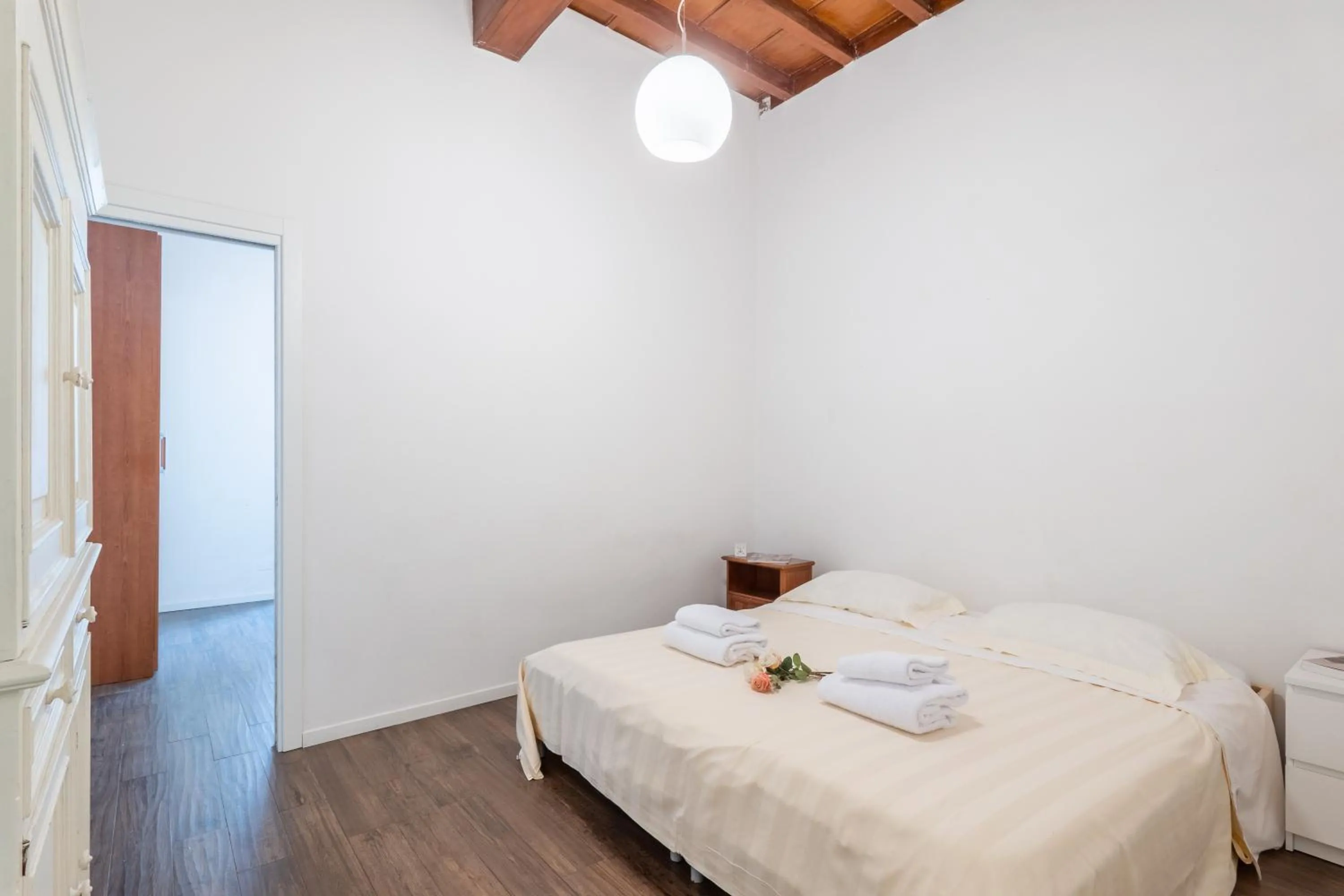 Bed in Palazzo Vecchio Apartments by Mmega