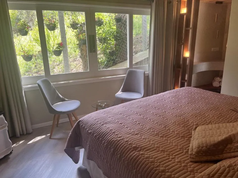 Bed in Pousada Vila das Cores