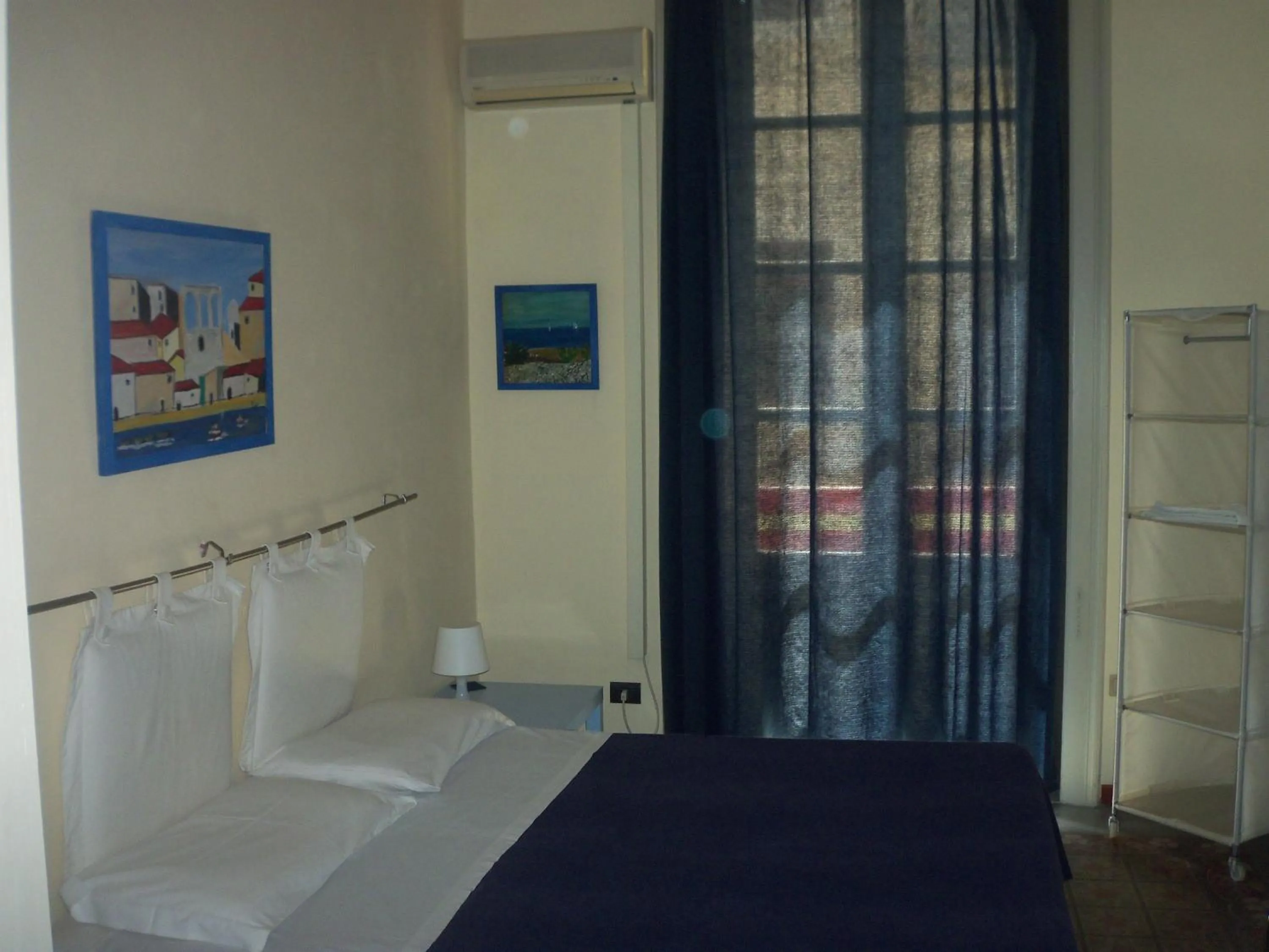 Photo of the whole room in B&B CARAVAGGIO basic rooms near Ortigia
