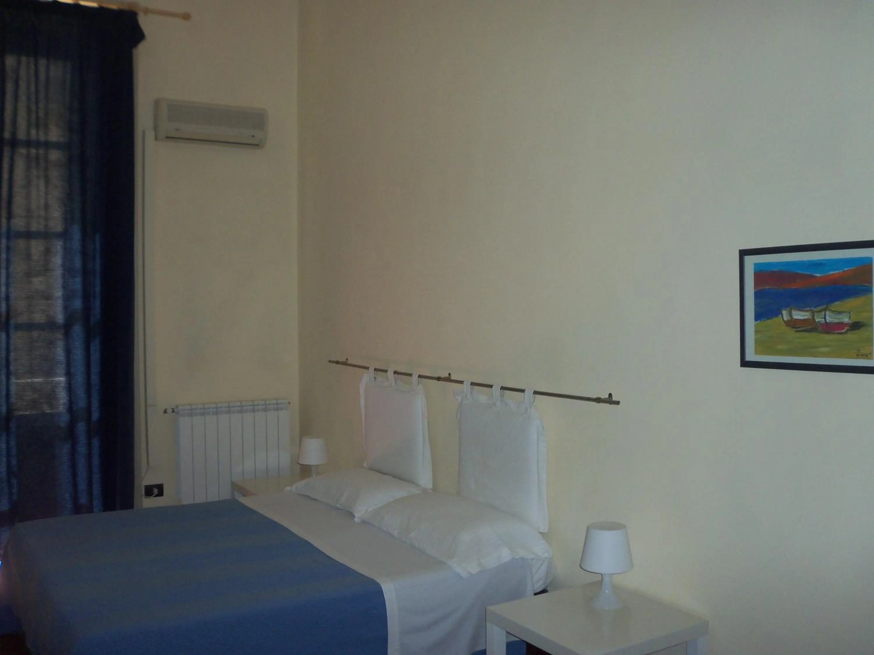 Photo of the whole room in B&B CARAVAGGIO basic rooms near Ortigia