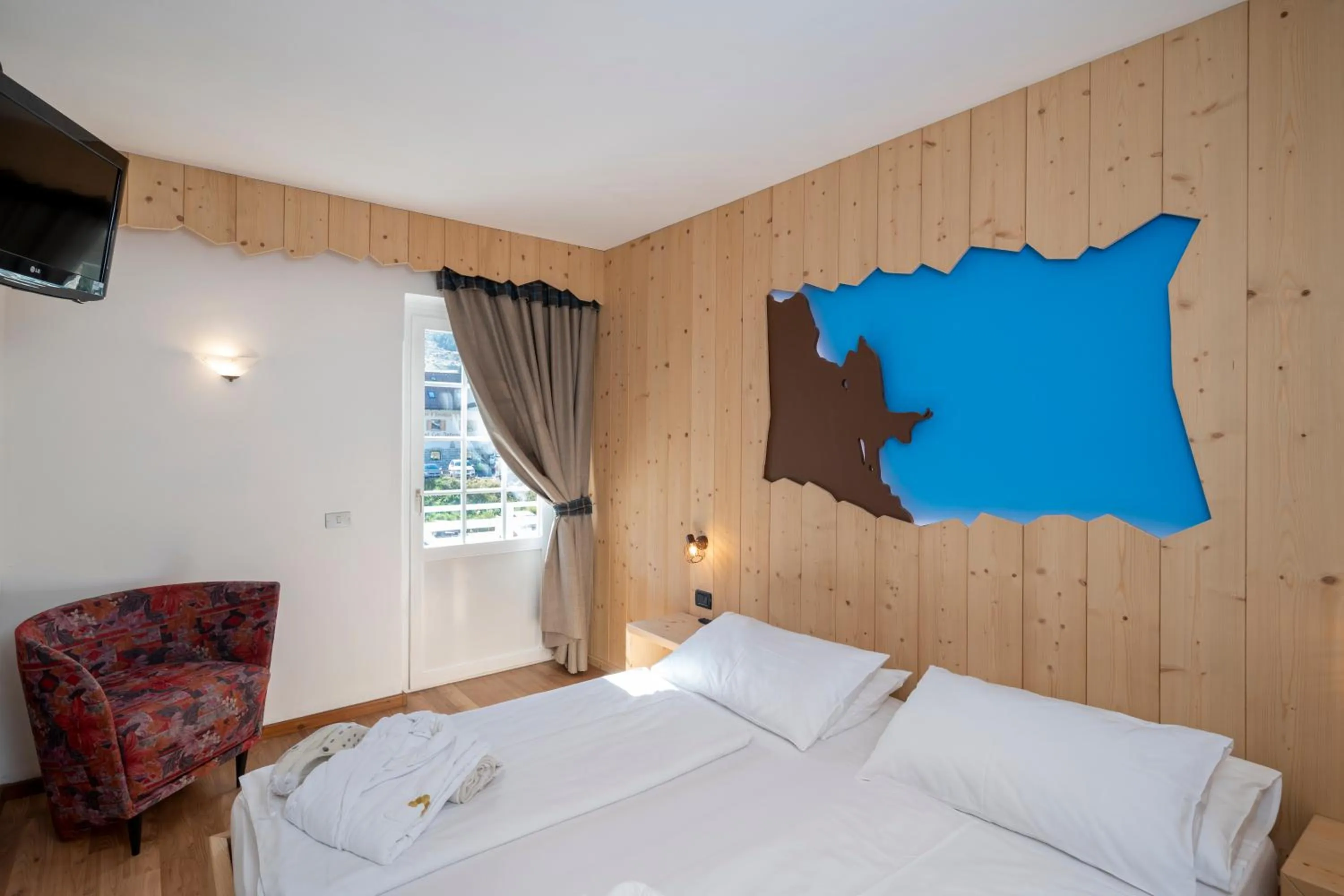 Bed in MyTime Hotels Savoy