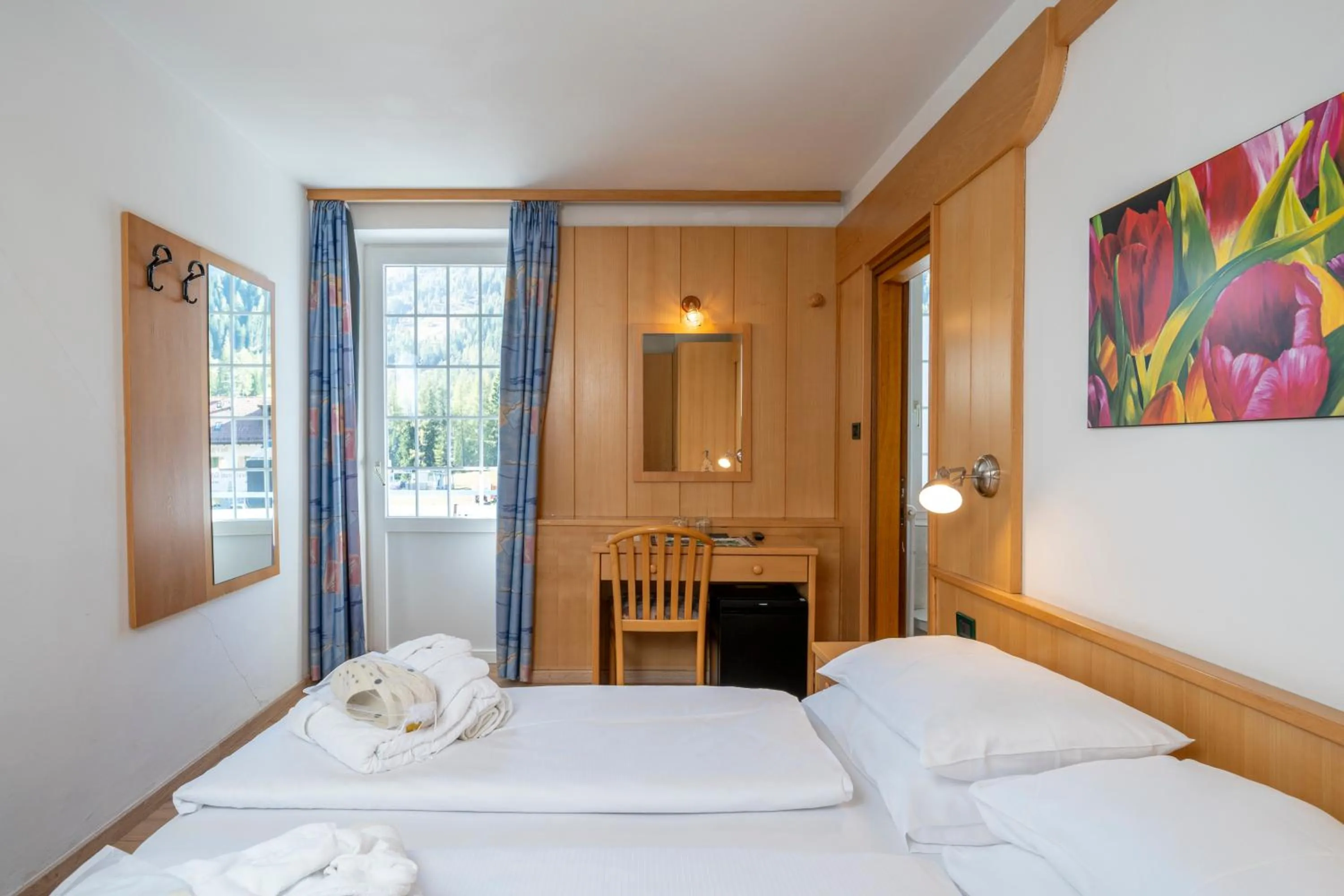 Bed in MyTime Hotels Savoy