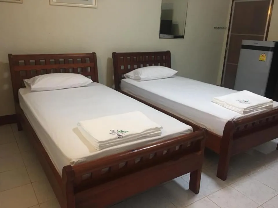 Bed in Baan Suan Nam Resort