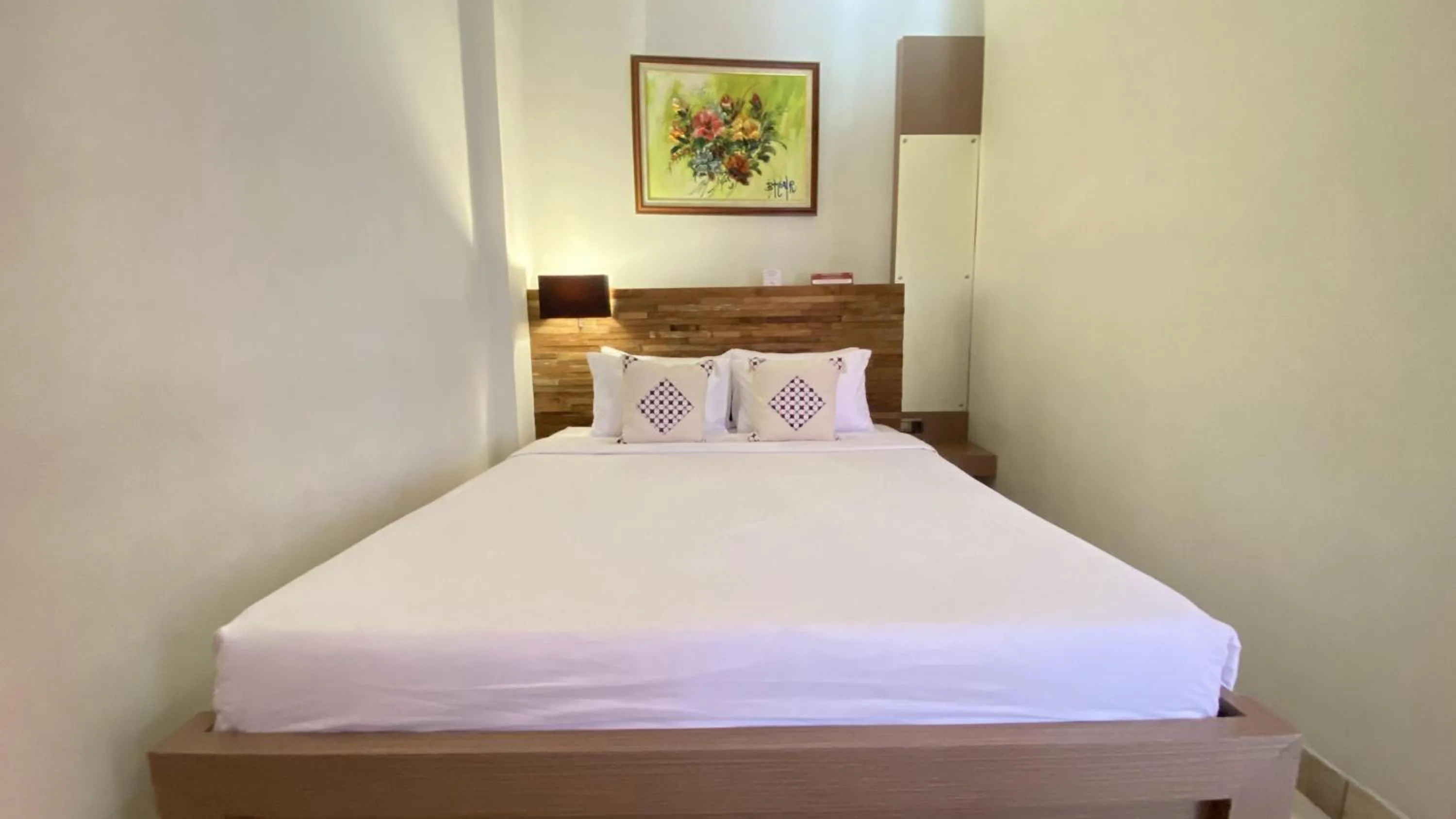 Bed in Mawar Asri Hotel