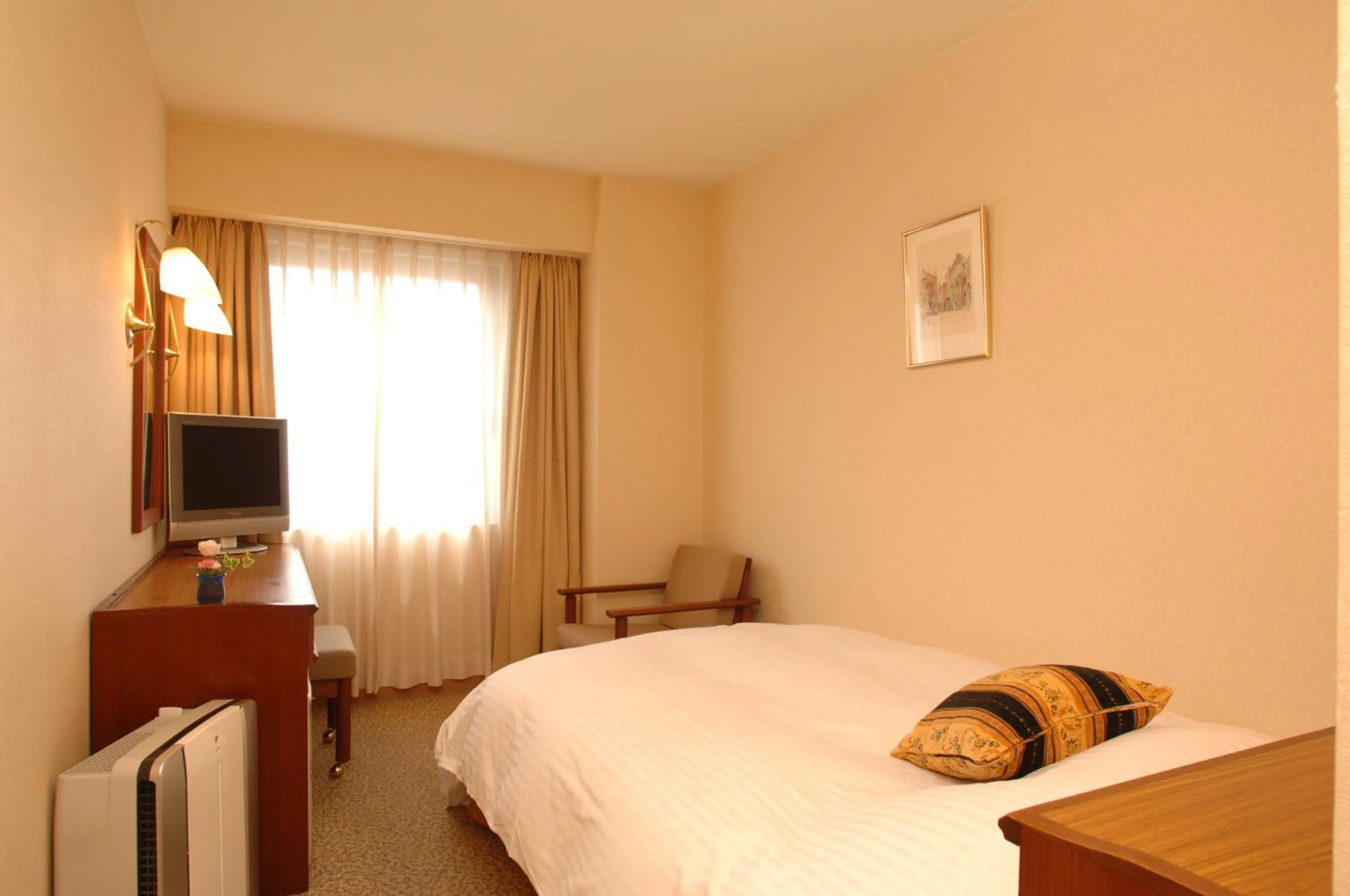 Bed in Grand Plaza Nakatsu Hotel