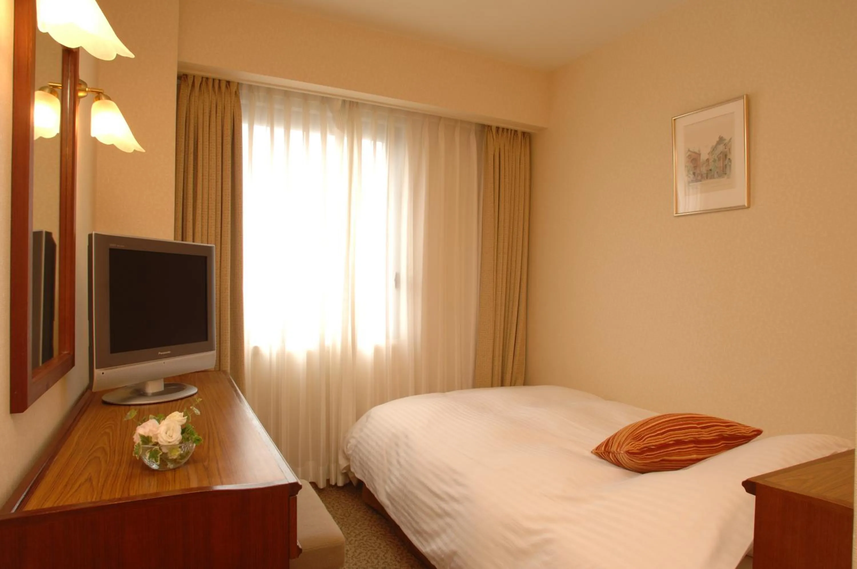 Bed in Grand Plaza Nakatsu Hotel