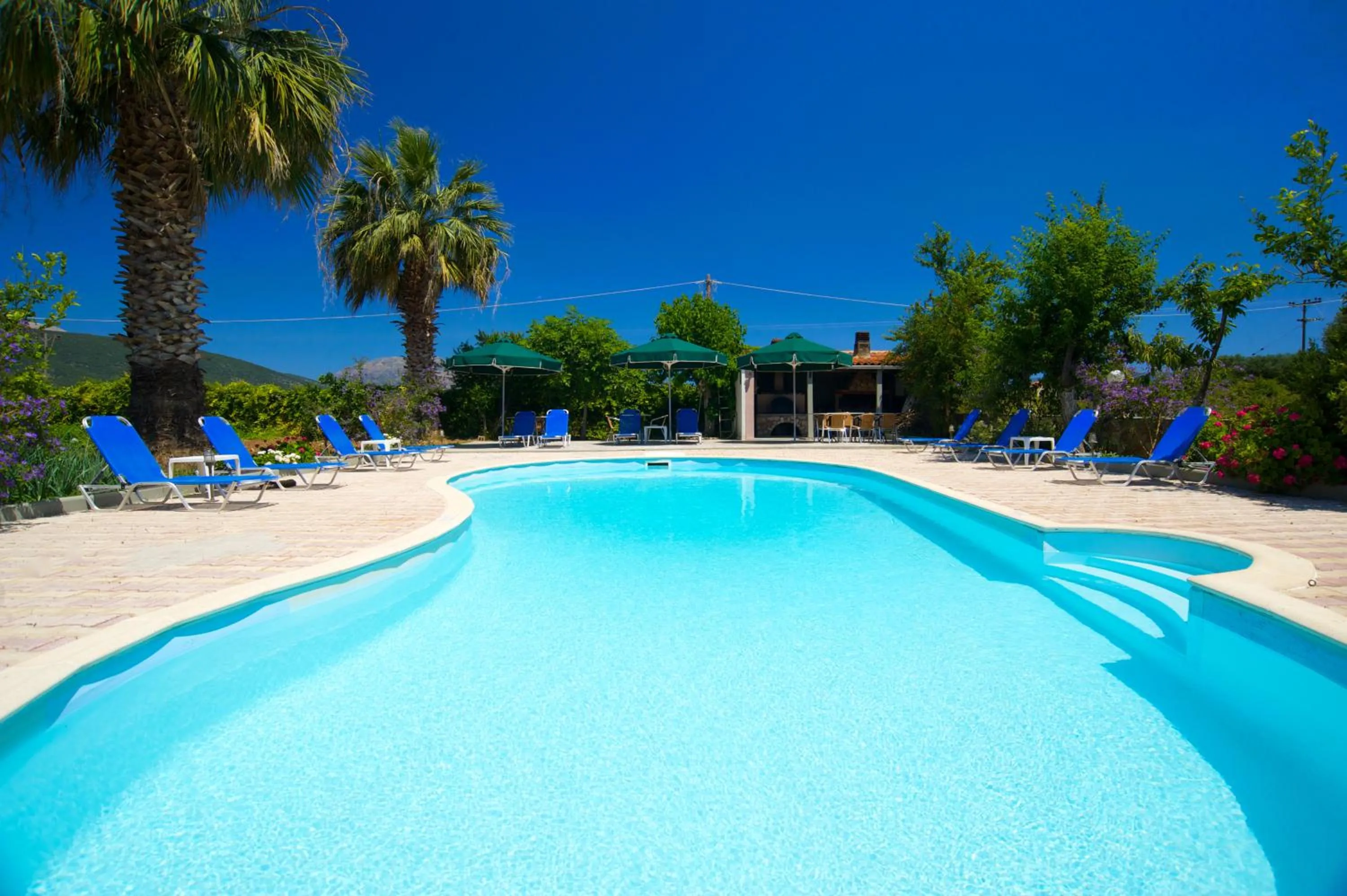 Swimming pool in Nikos Studios and Apartments