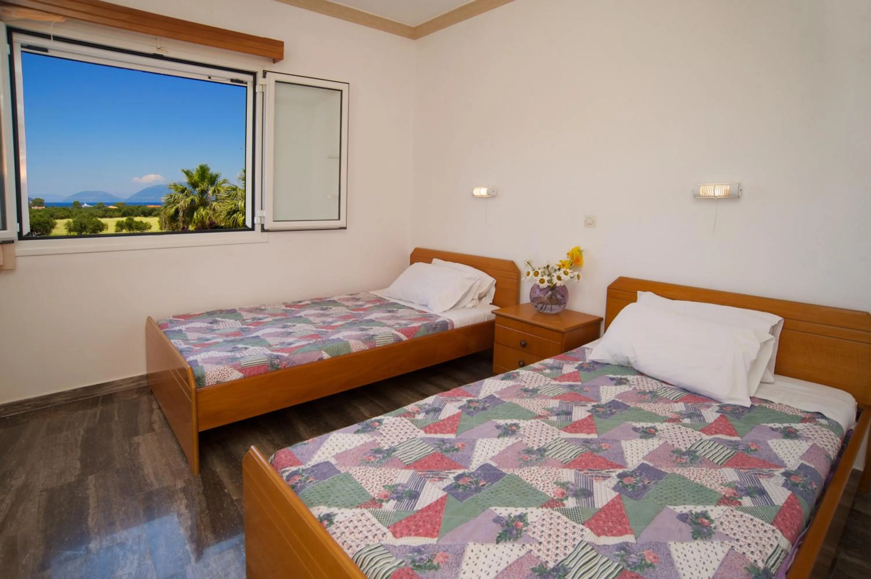Bed in Nikos Studios and Apartments
