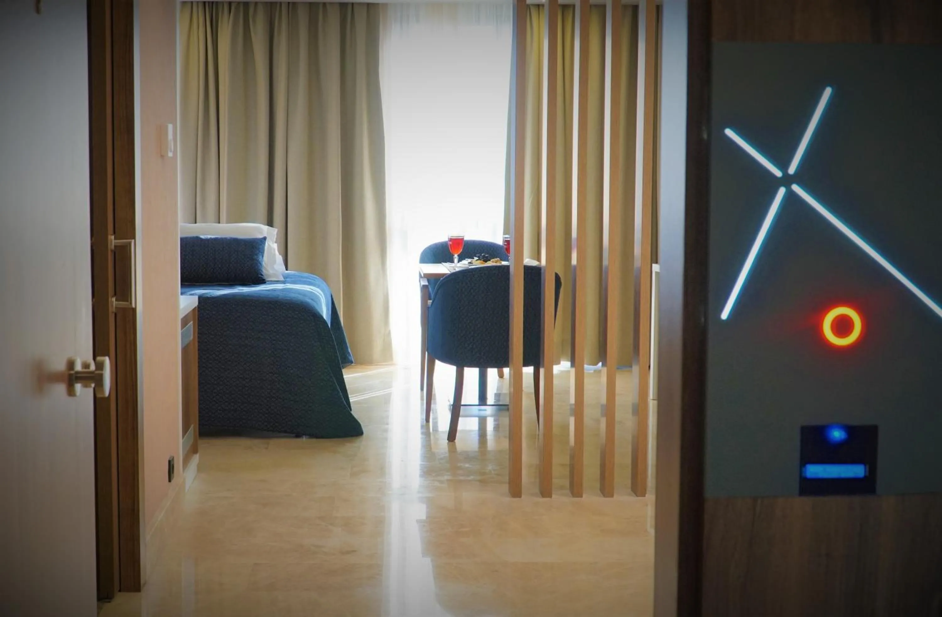 Seating area, Bed in Extenso Hotel