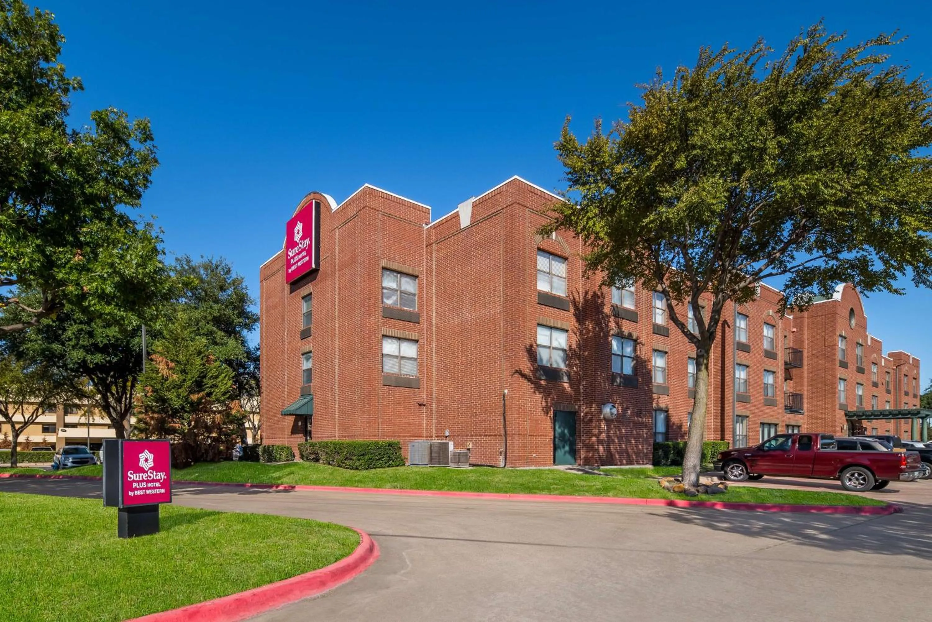 Property building in SureStay Plus Hotel by Best Western Plano