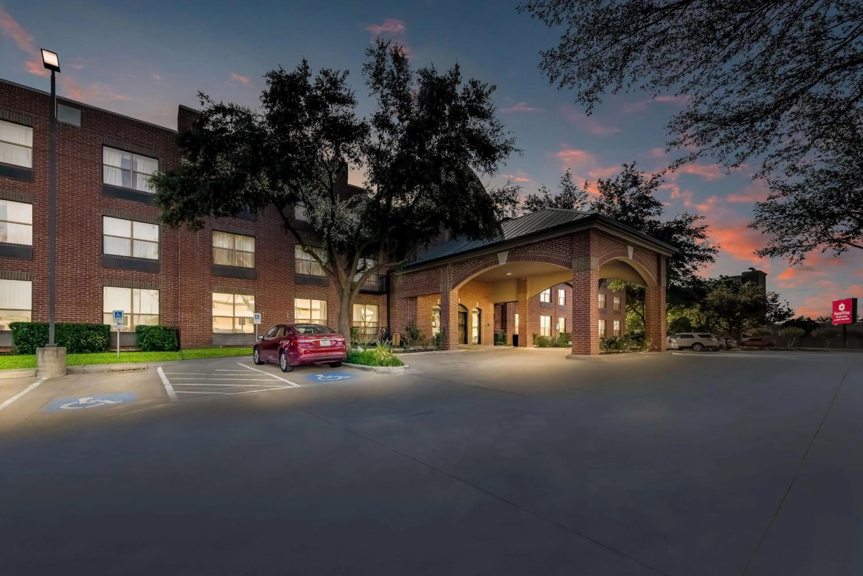 Property building in SureStay Plus Hotel by Best Western Plano