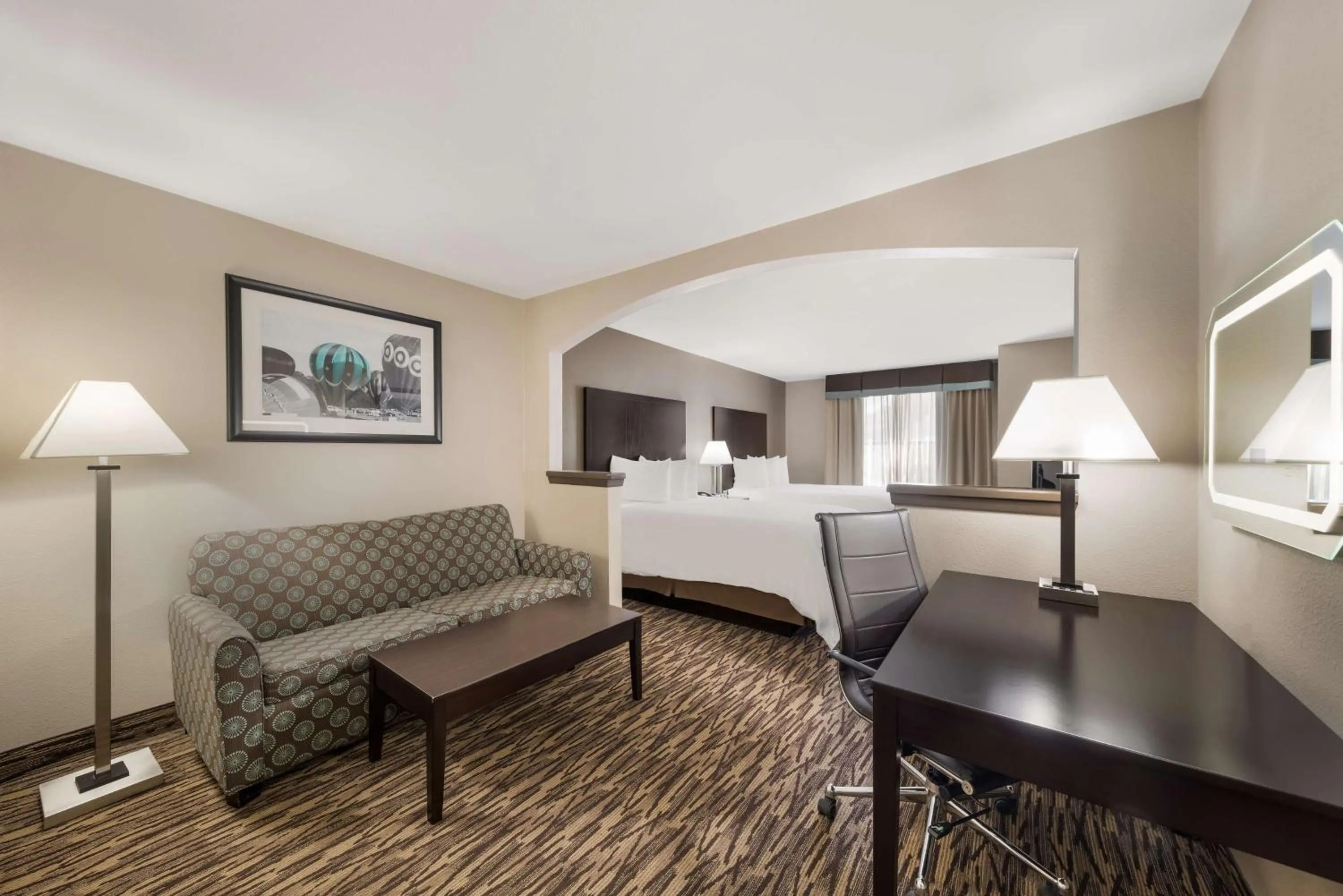 Seating area in SureStay Plus Hotel by Best Western Plano